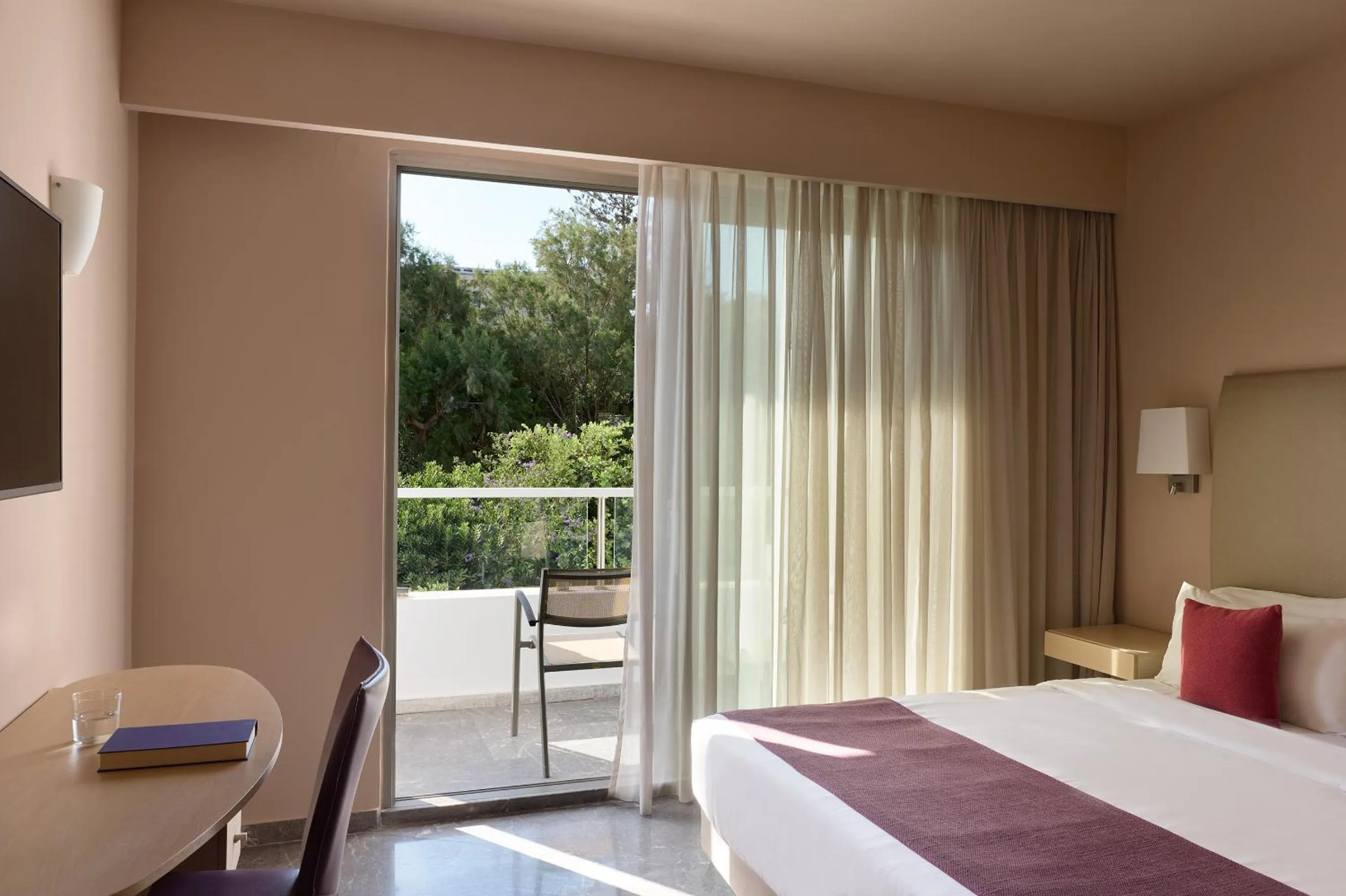 Bed in Atlantica Akti Zeus Hotel