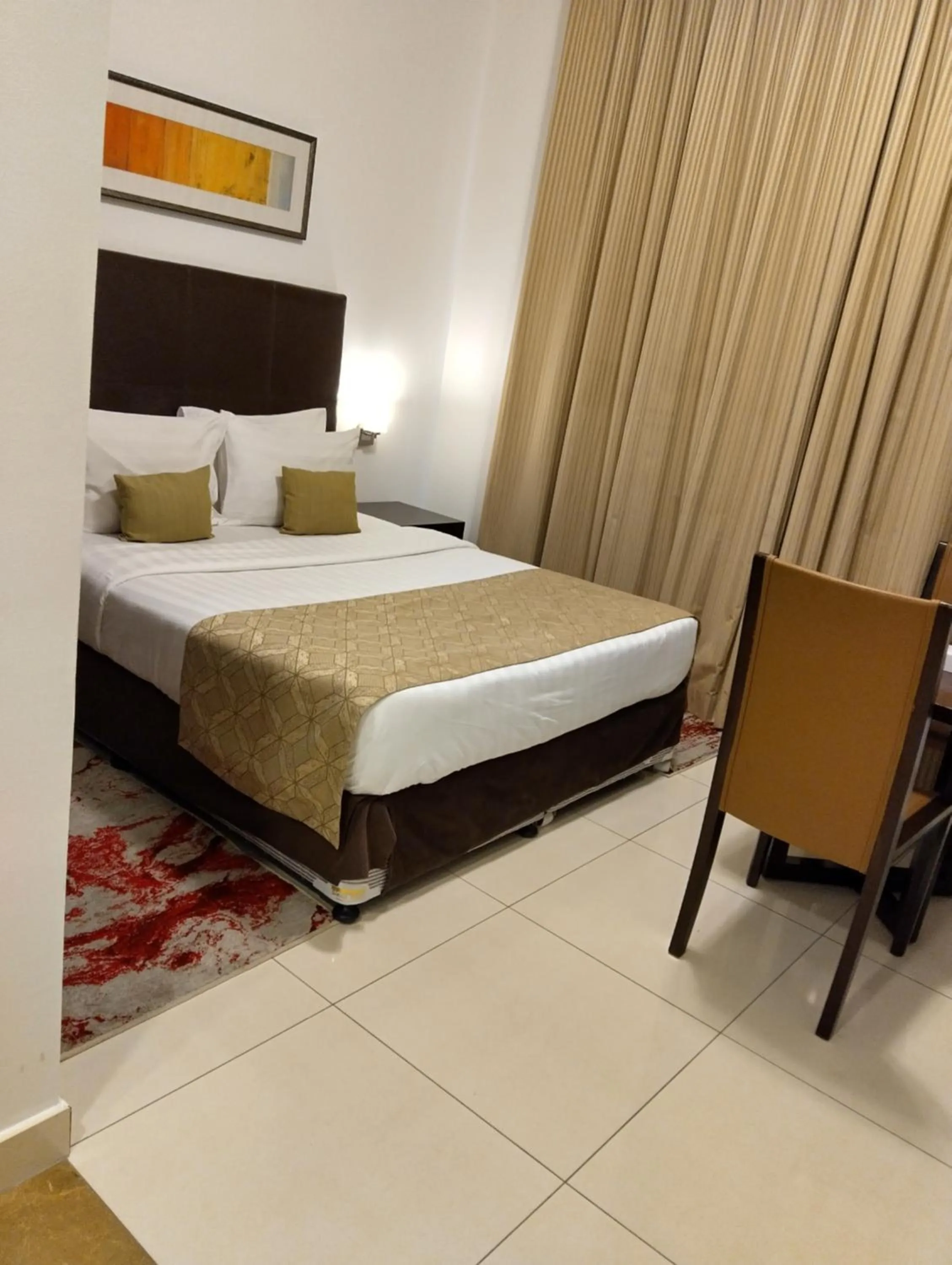 Bed in Tulip Creek Hotel Apartments