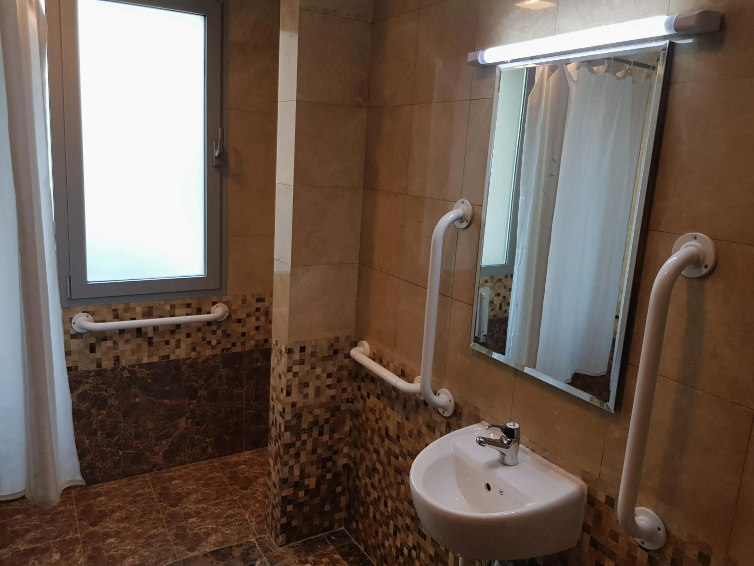 Shower in Tulip Creek Hotel Apartments