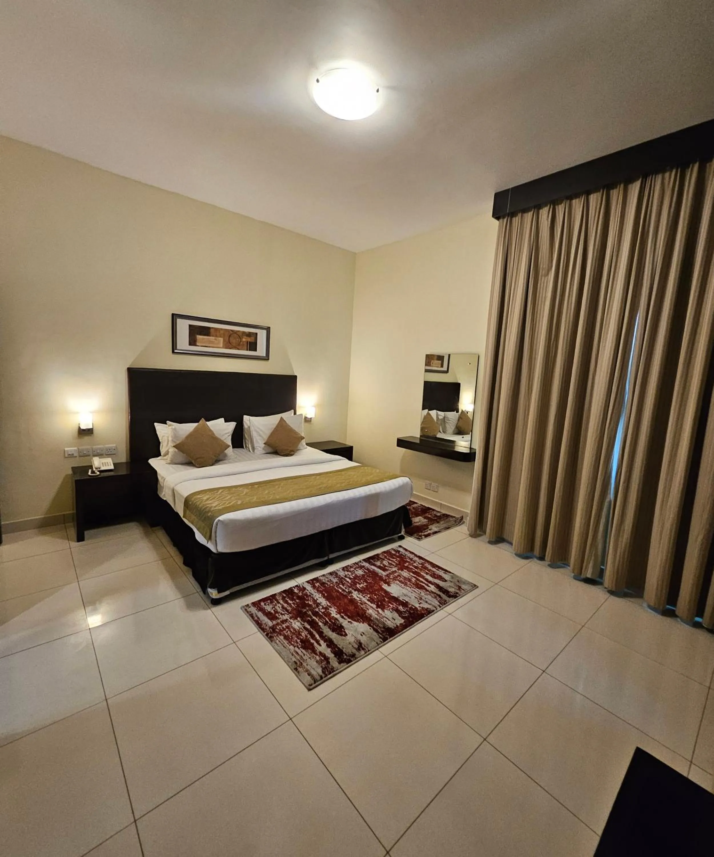 Bed in Tulip Creek Hotel Apartments