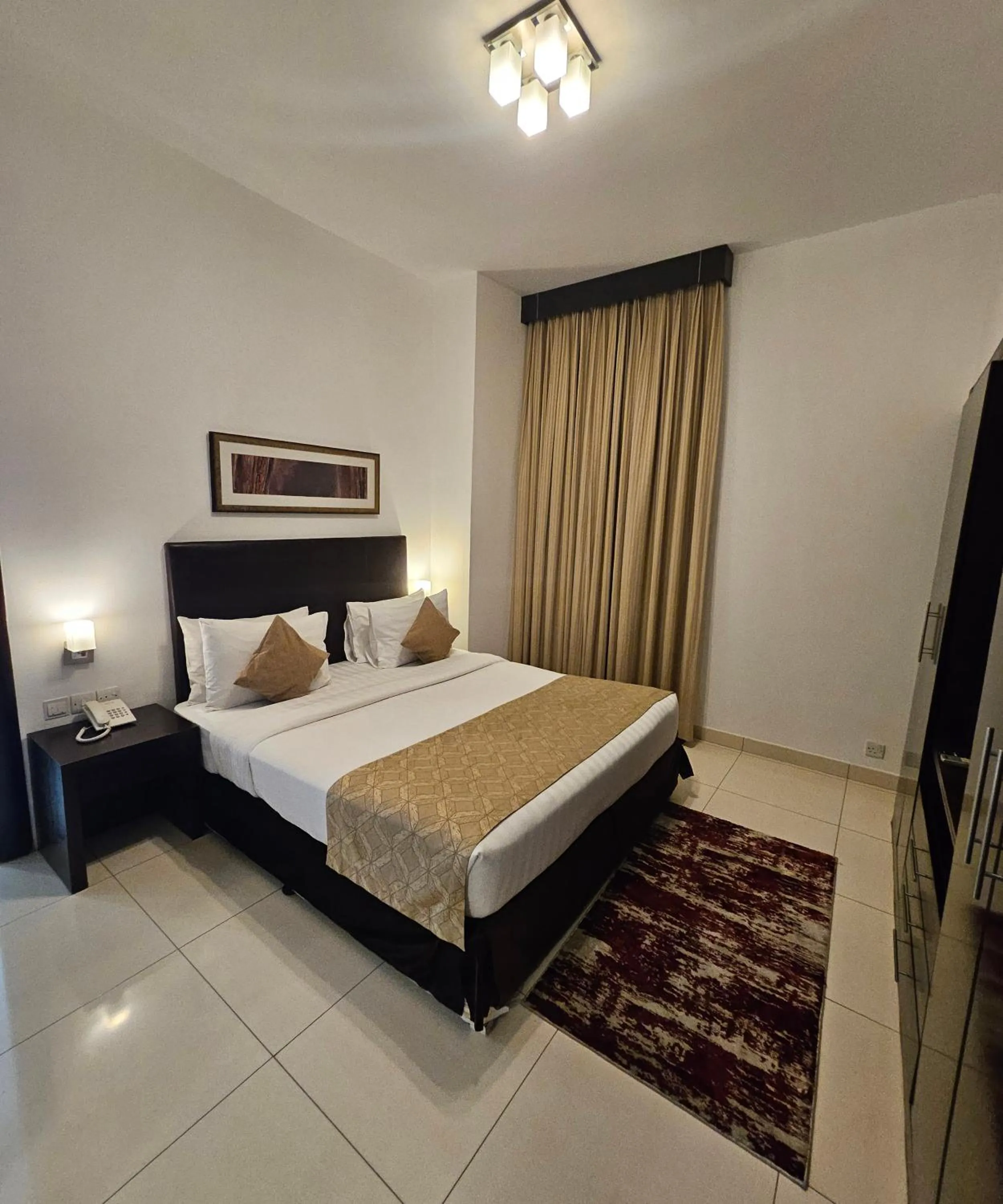 Bed in Tulip Creek Hotel Apartments