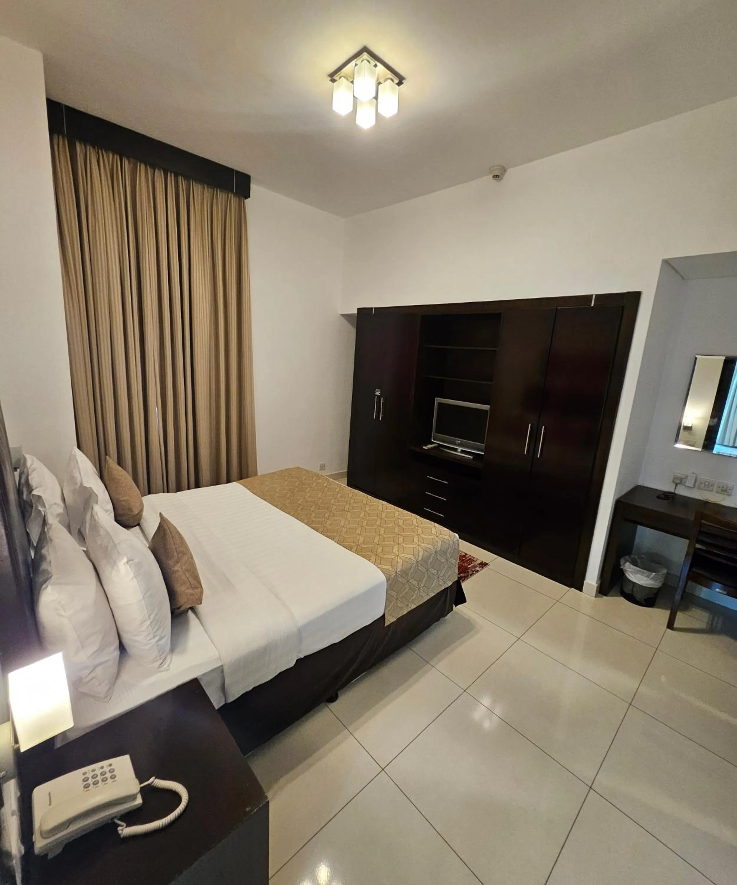 Bed in Tulip Creek Hotel Apartments