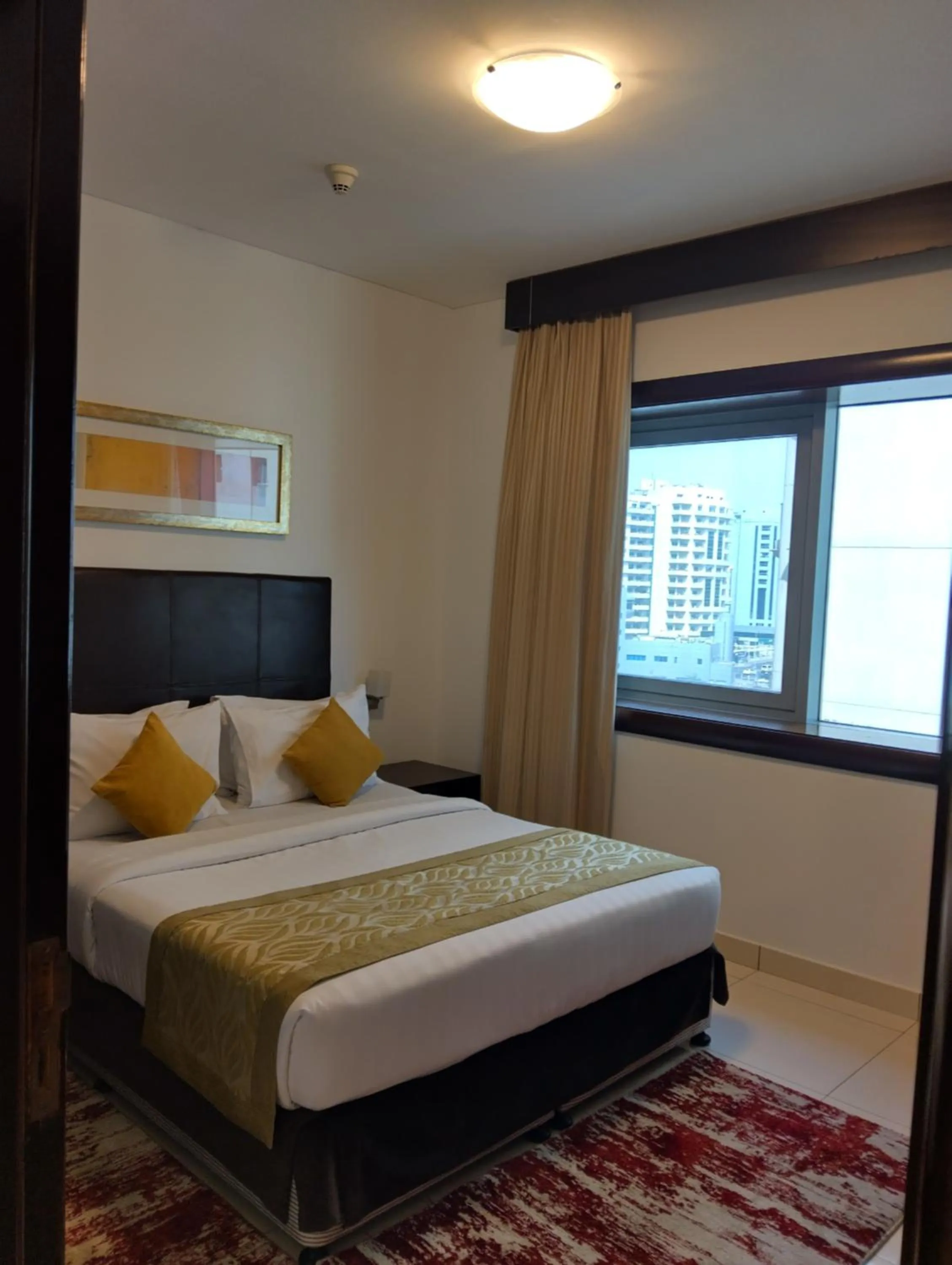 Bed in Tulip Creek Hotel Apartments