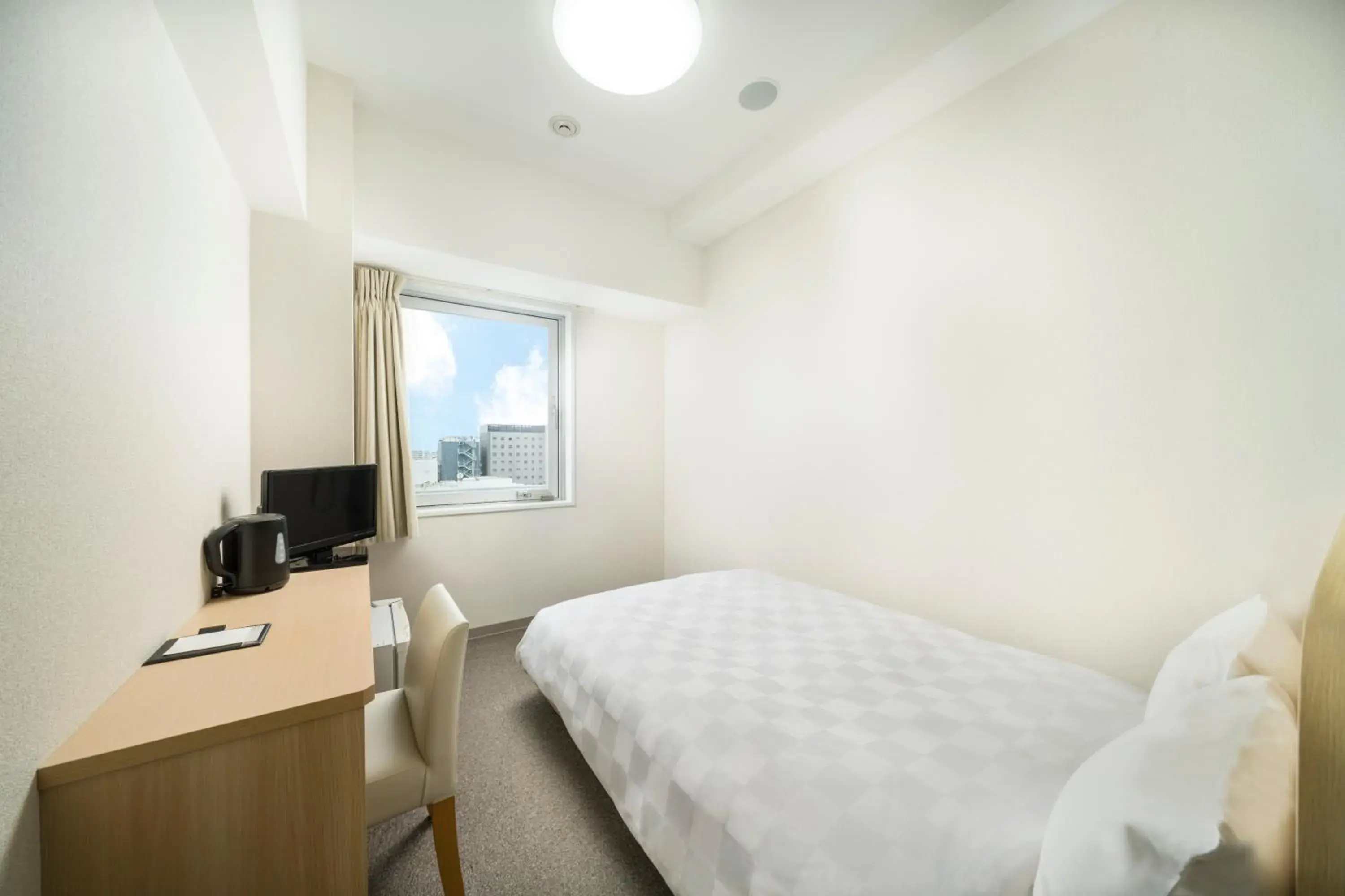 Photo of the whole room, Bed in KOKO HOTEL Kagoshima Tenmonkan Photo of the whole room, Bed in KOKO HOTEL Kagoshima Tenmonkan