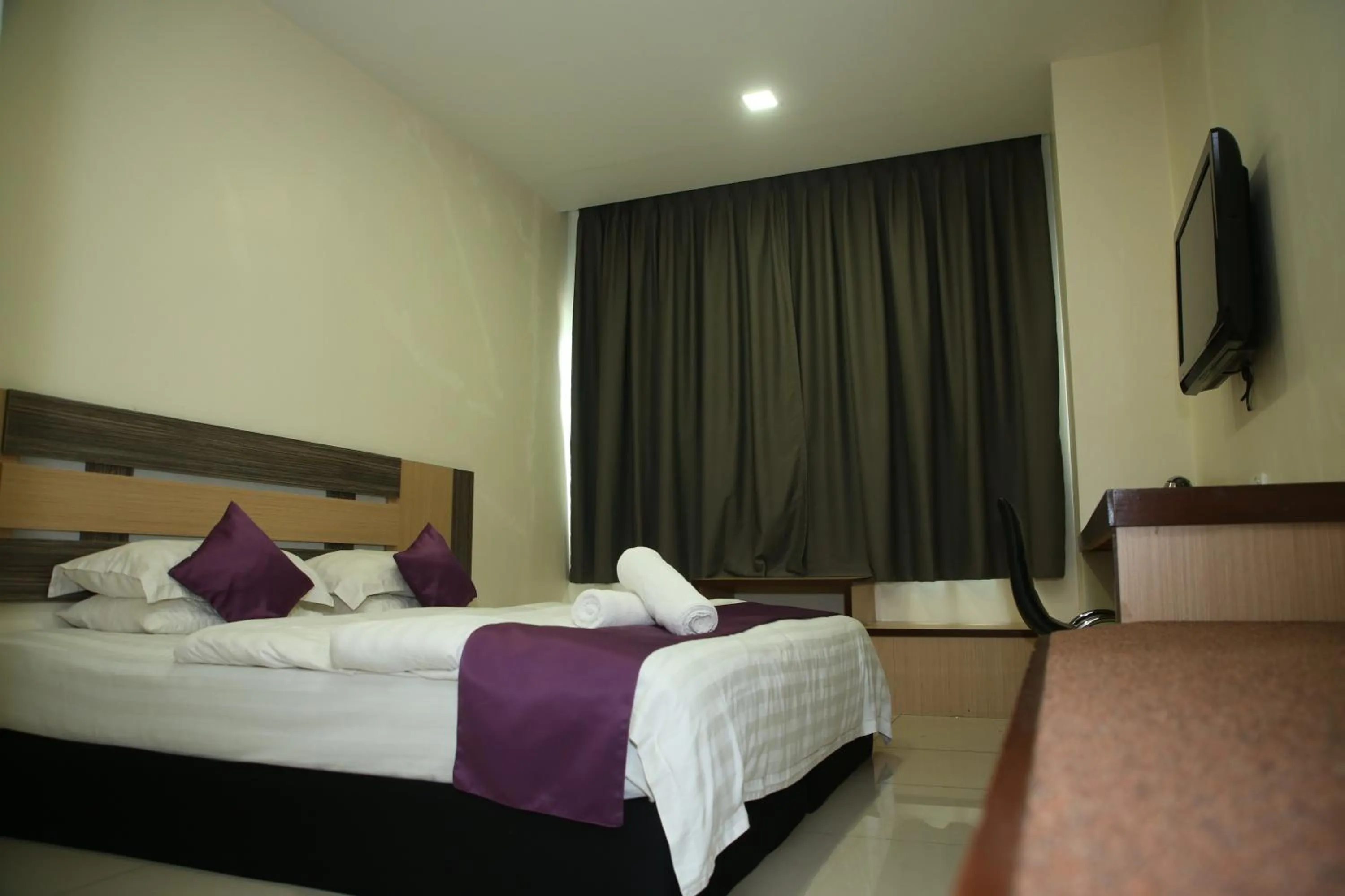 Bed in MY Fame Hotel