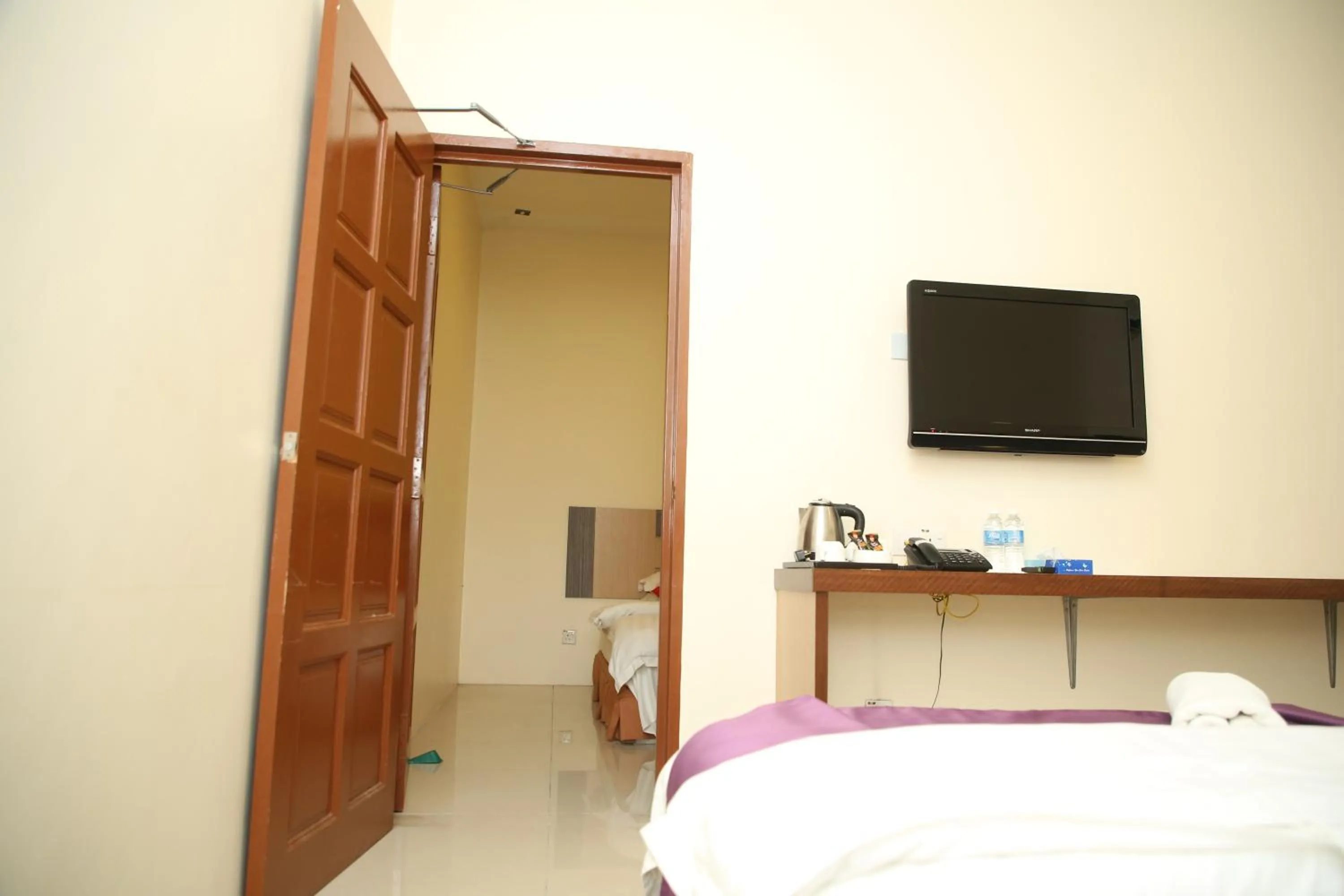 Bed in MY Fame Hotel