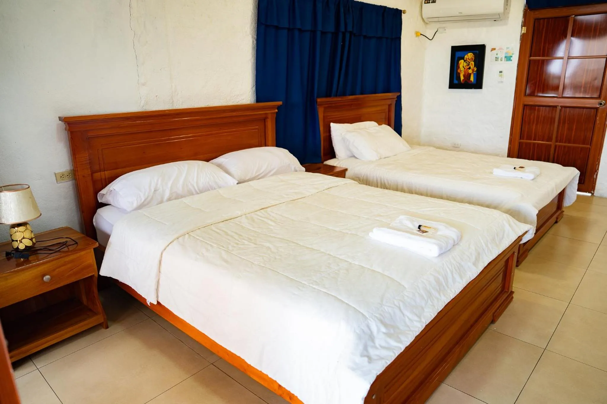 Bed in Royal Galápagos Inn