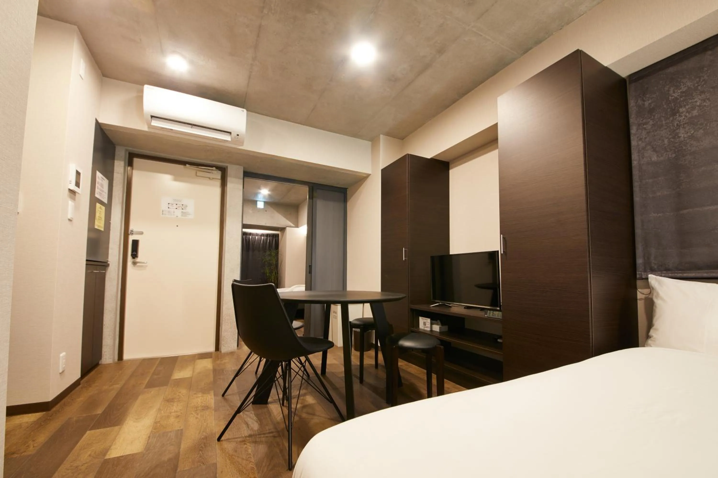 Living room, Bed in Prime Suites Tokyo