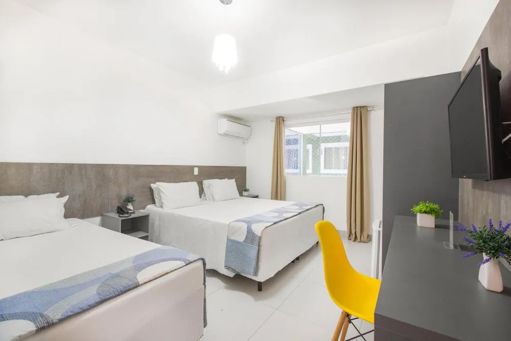 Bed in Hotel Cajueiro Guarujá