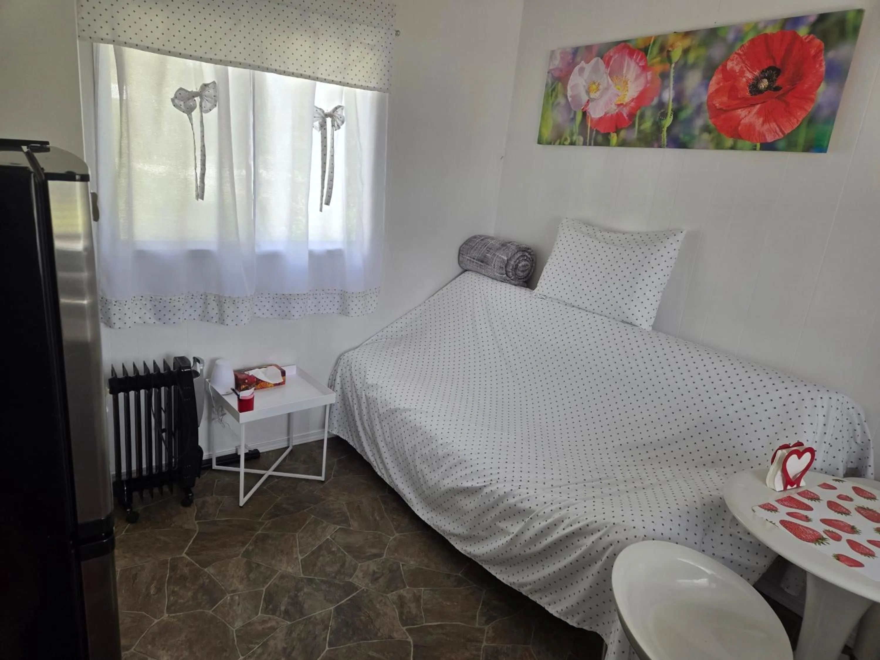 Bed in Blue River Campgrounds & Cabin-public washroom