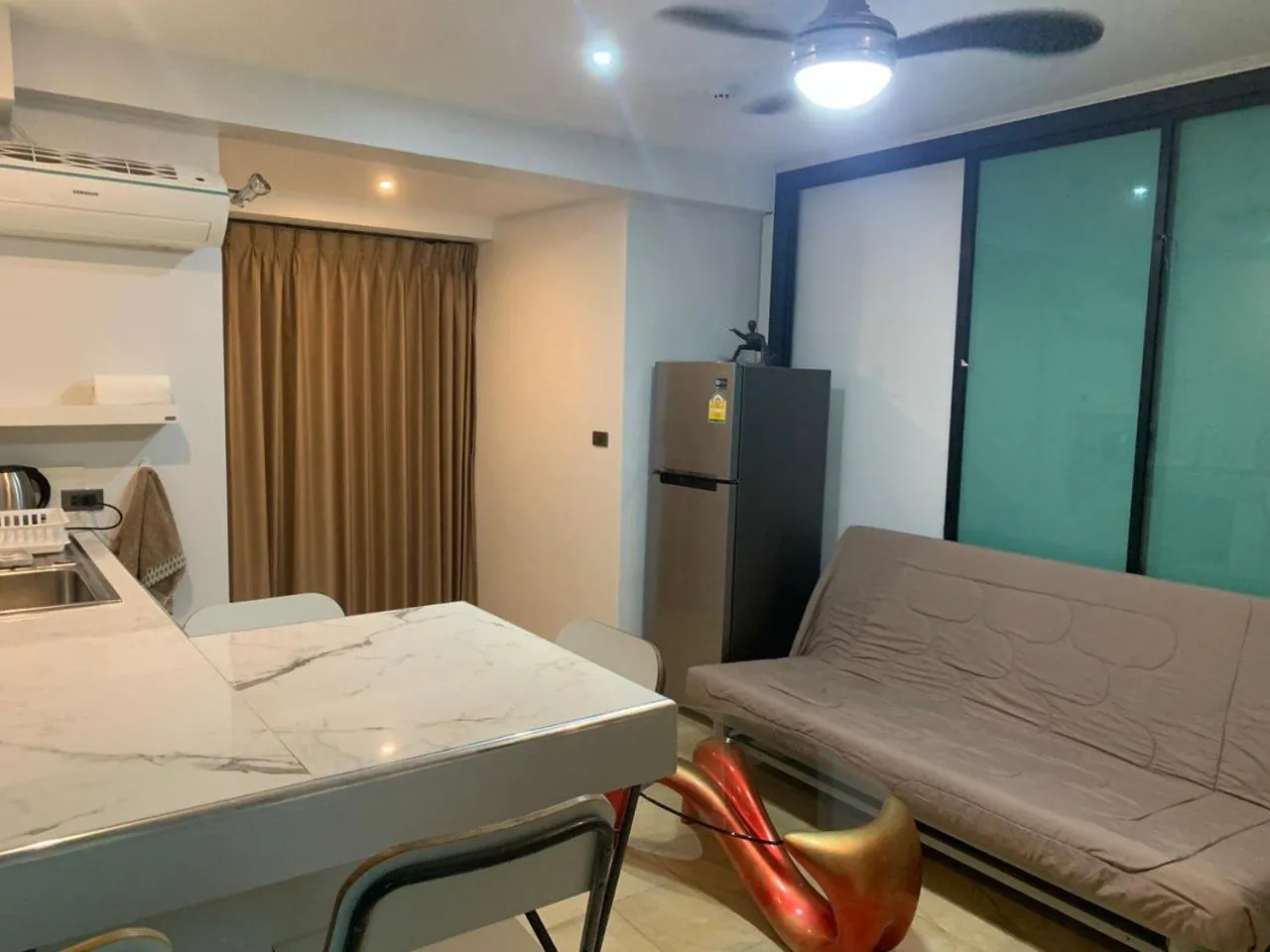 Dining area, Bed in Penthouse Crystal Bay Apartments