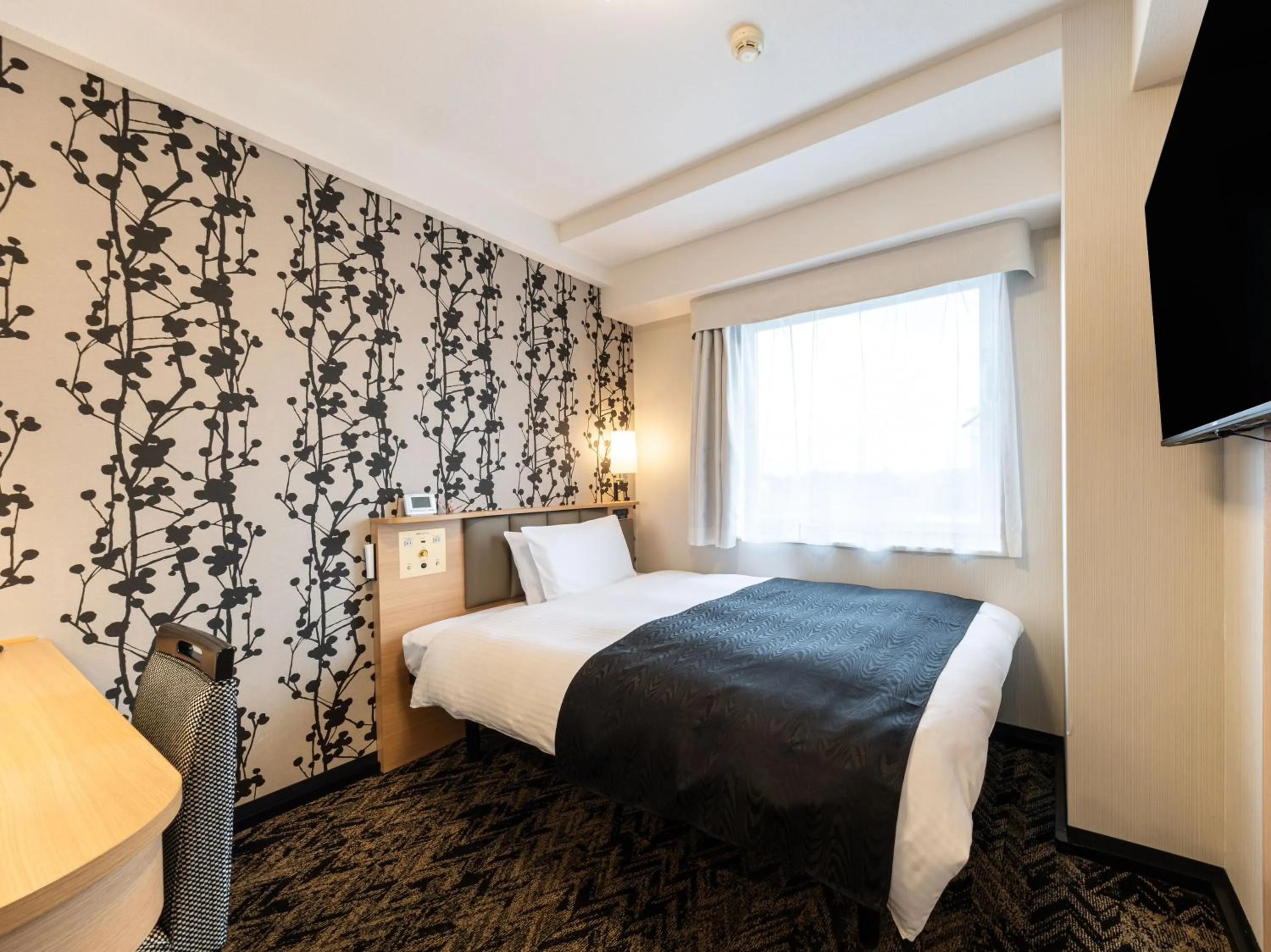 Bed in APA Hotel Kagoshima Chuo Ekimae