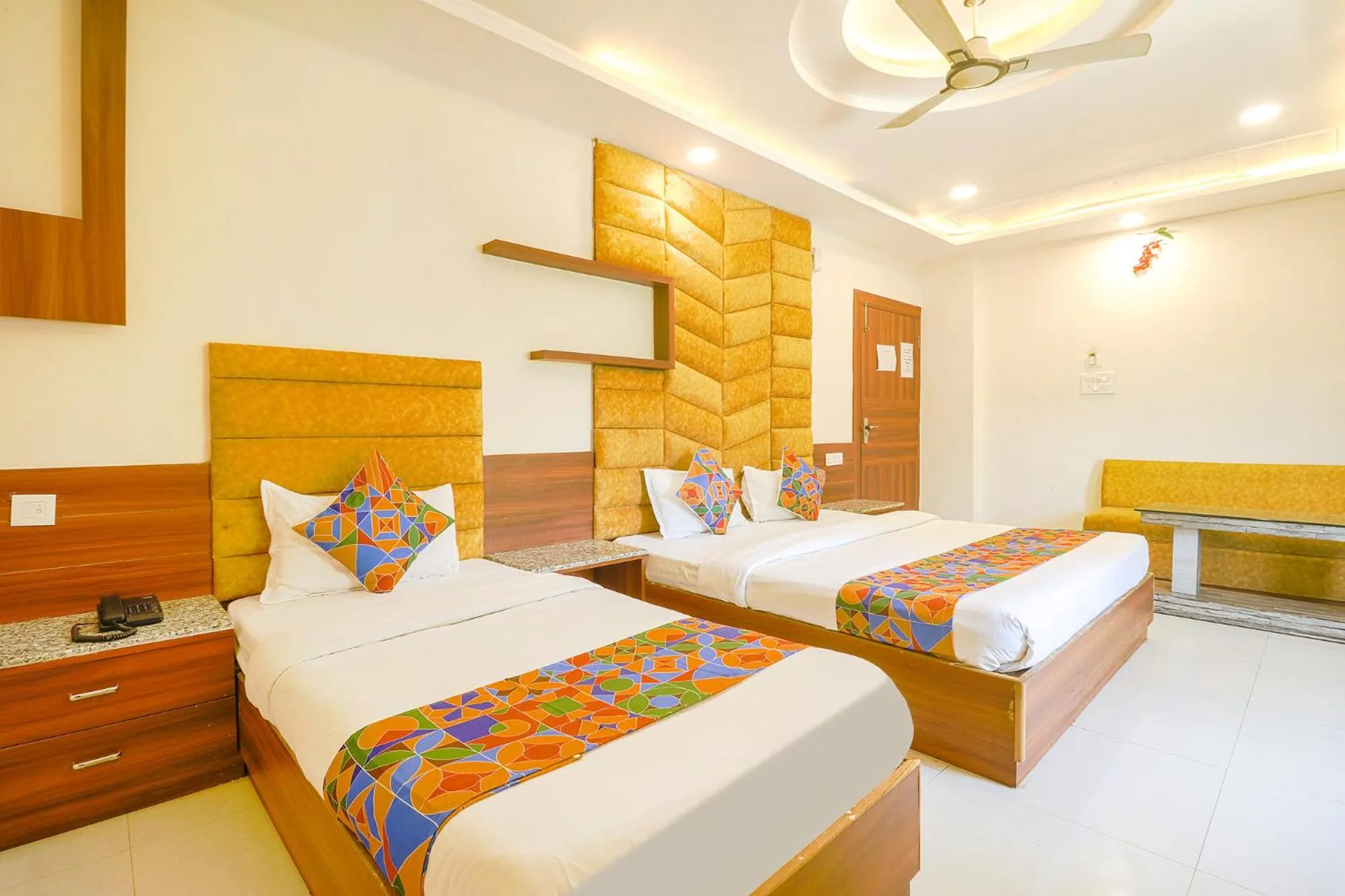 Bed in FabHotel Royal Aanandam