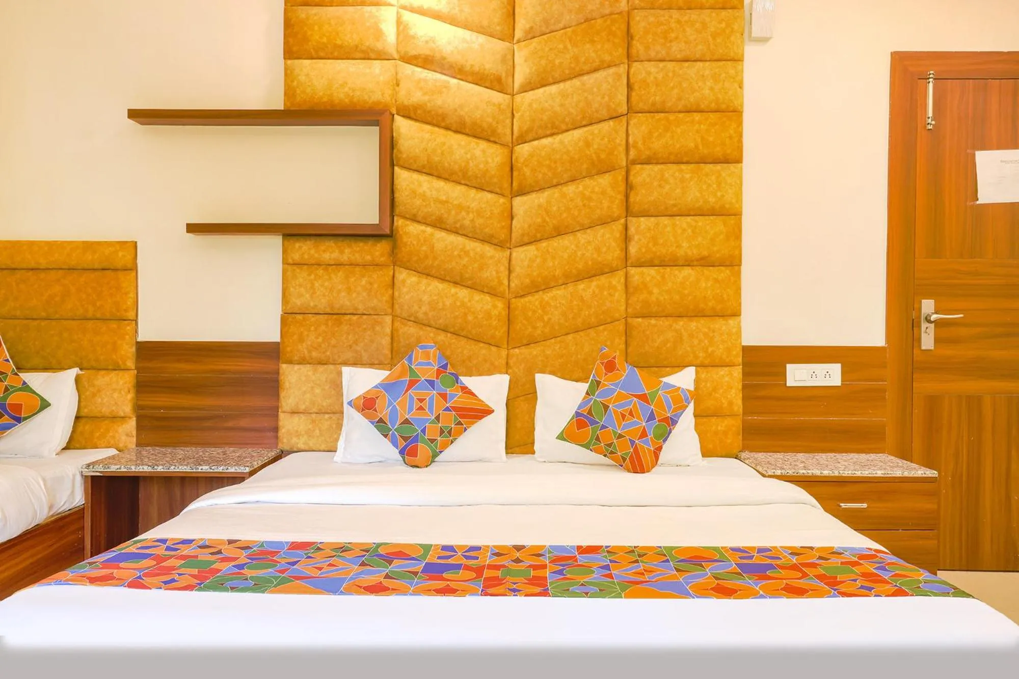 Bed in FabHotel Royal Aanandam