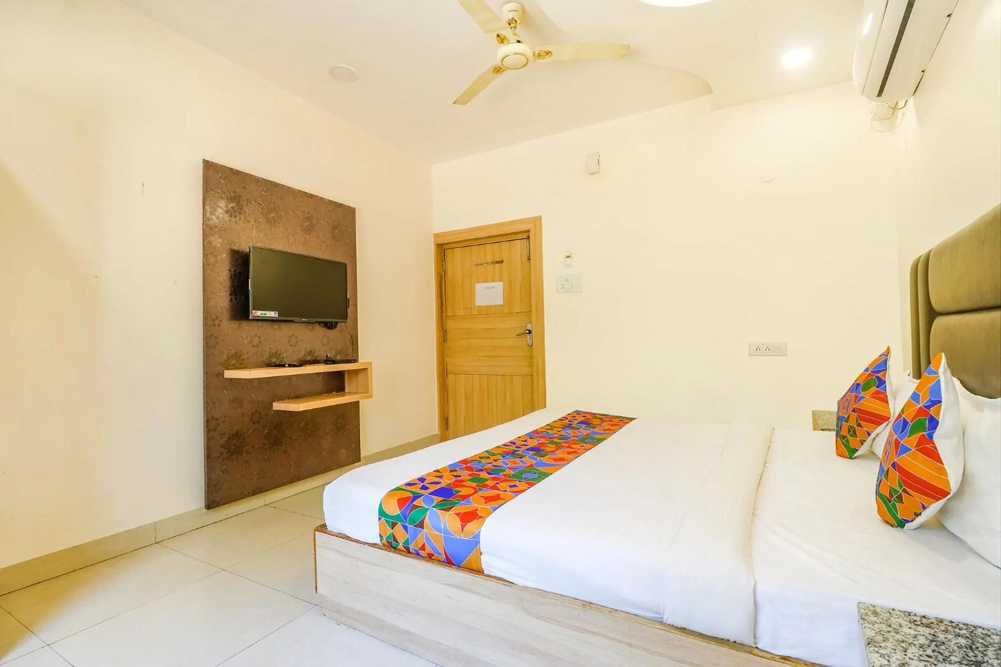 Bed in FabHotel Royal Aanandam
