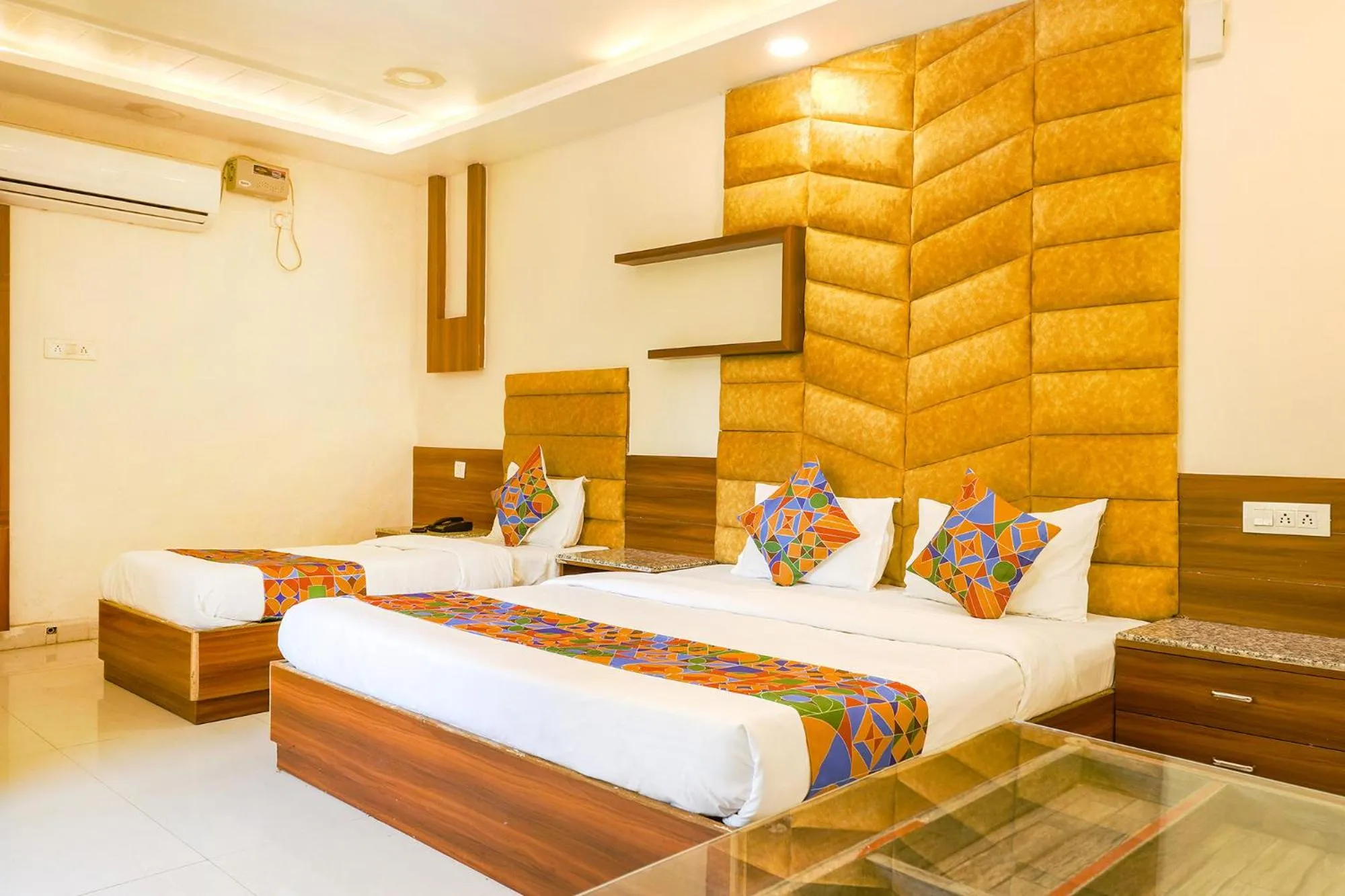 Bed in FabHotel Royal Aanandam