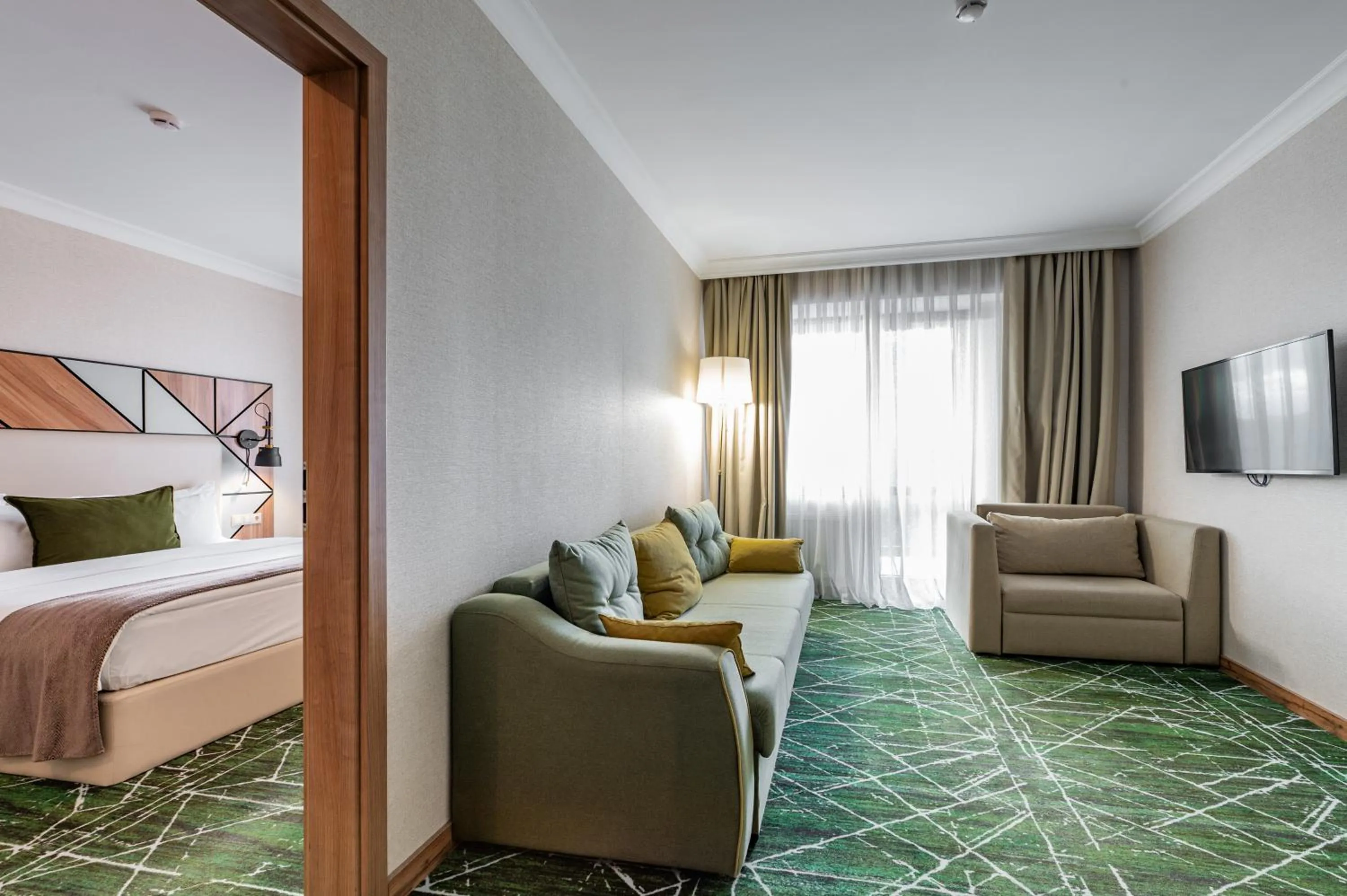 Living room, Bed in Wyndham Garden Burabay