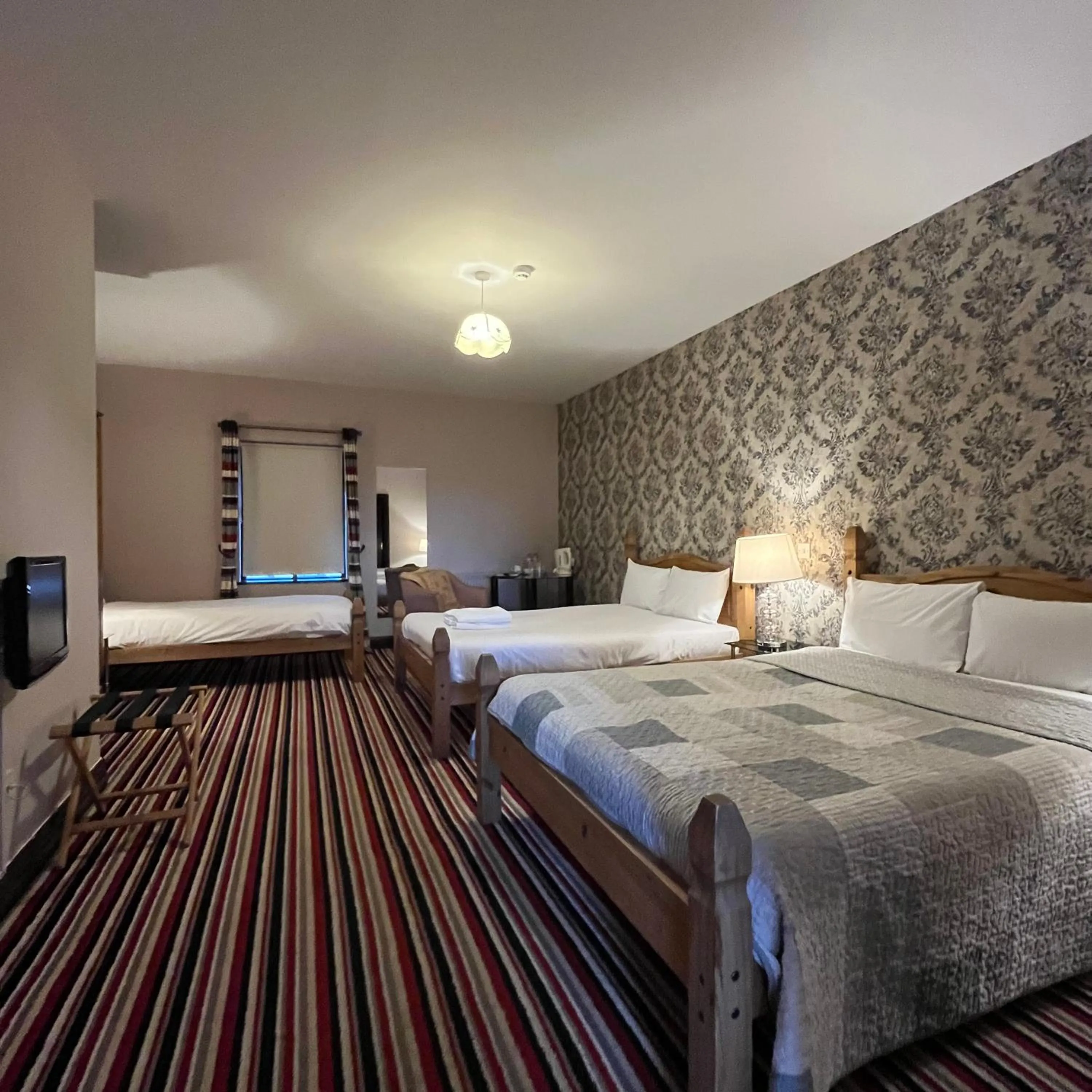 Bed in The Yeats County Inn Hotel