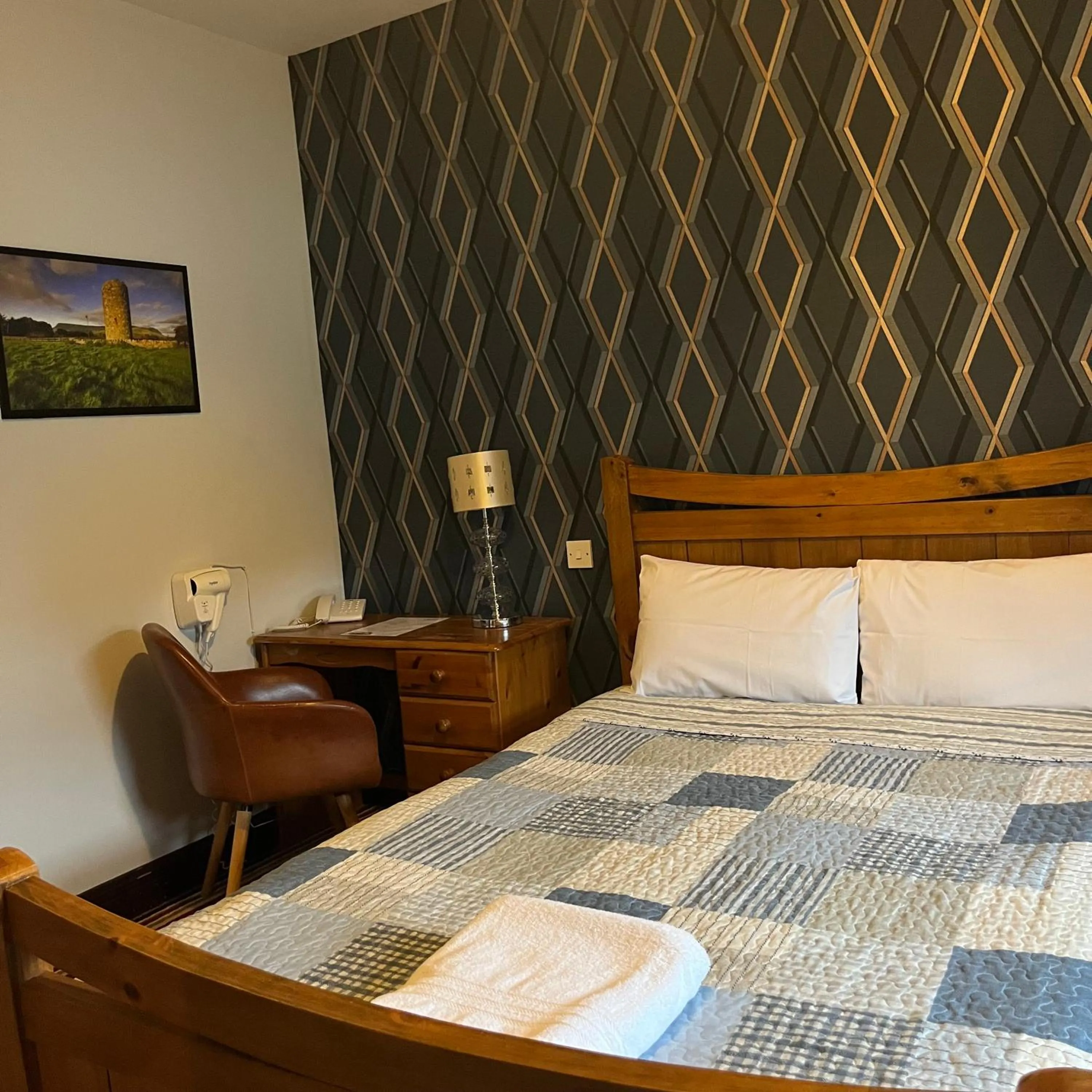 Bed in The Yeats County Inn Hotel