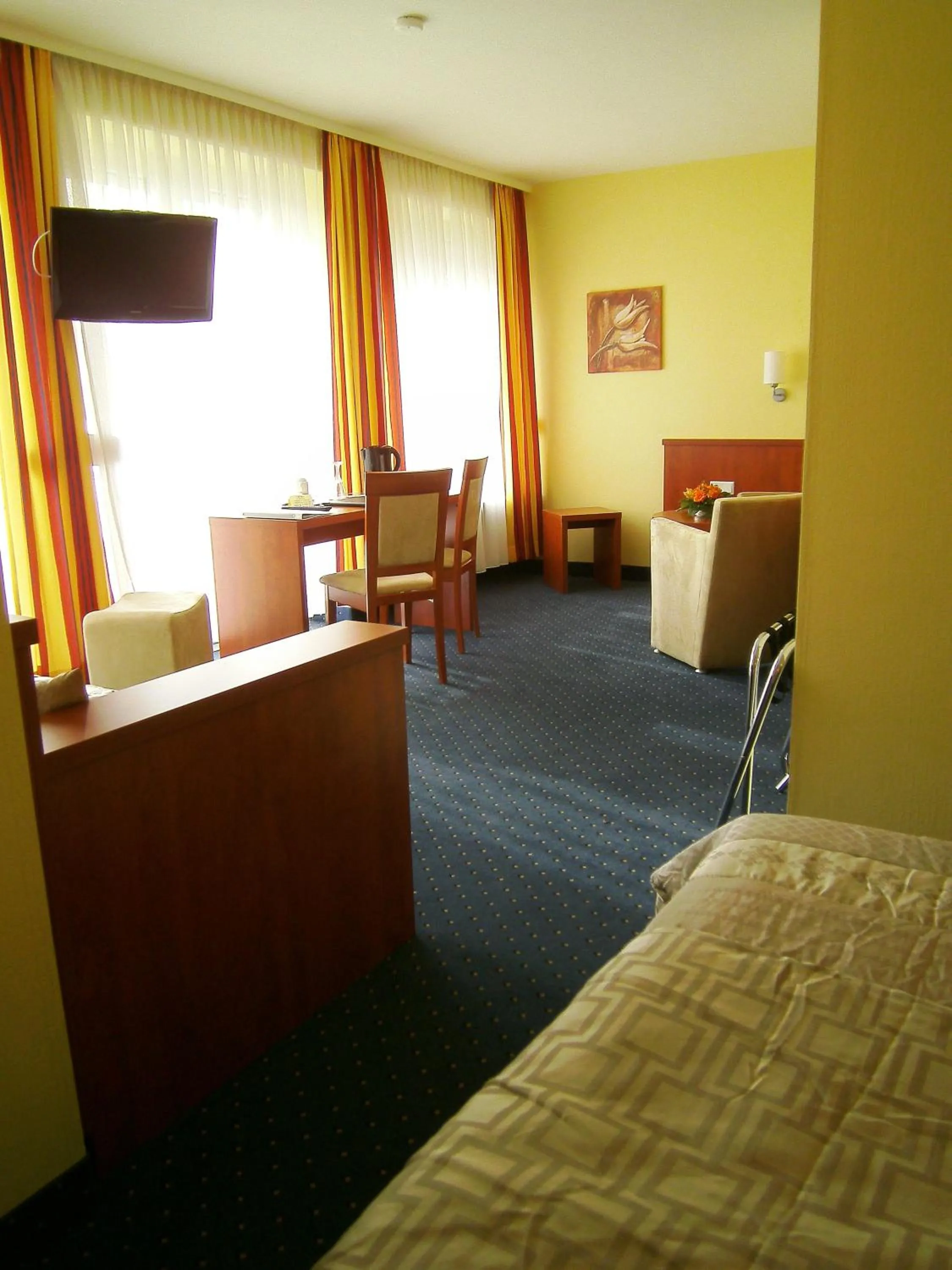 Seating area, Bed in Park Hotel Rüdesheim