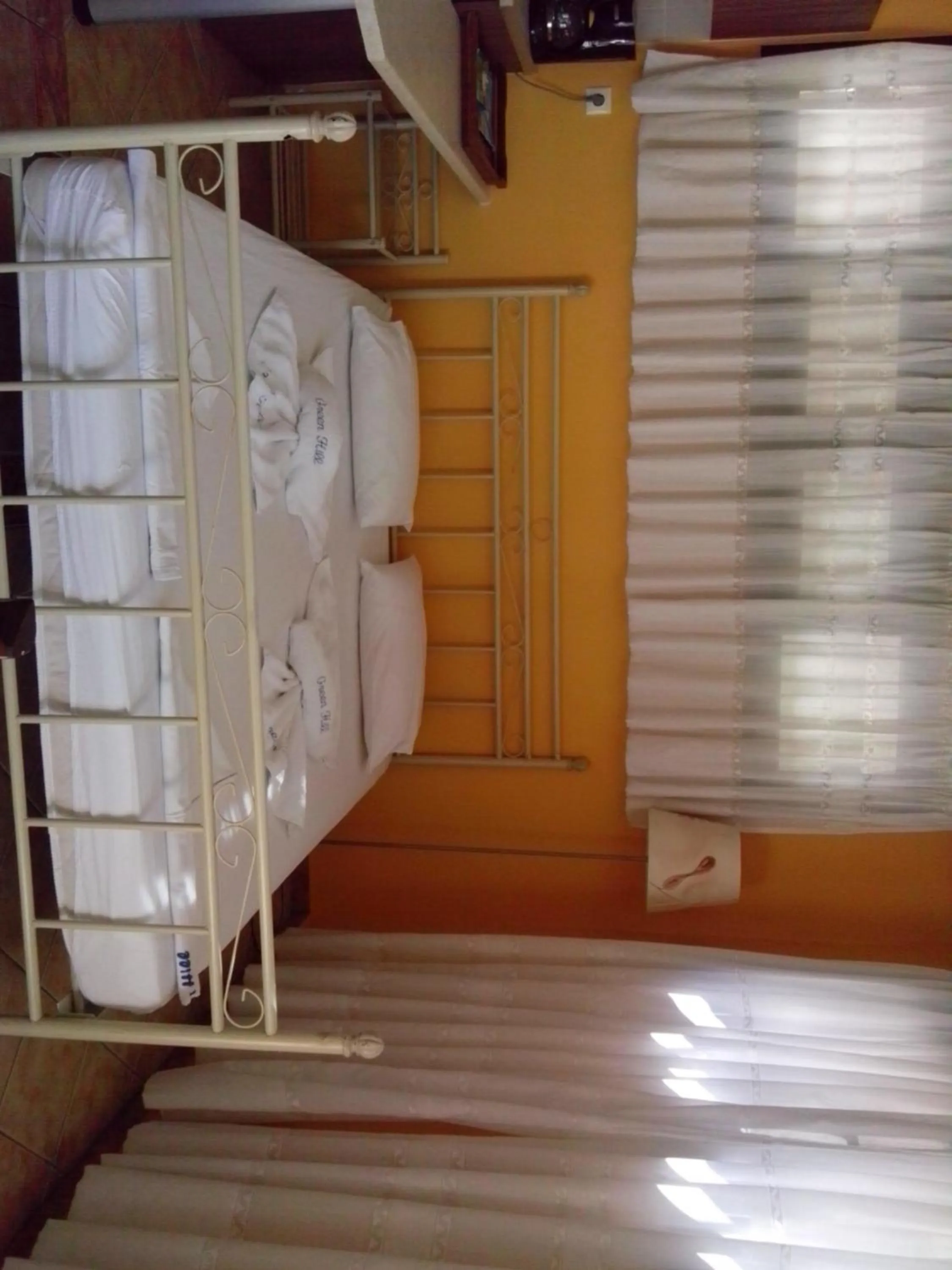 Bedroom in Green Hill Studios & Apartments