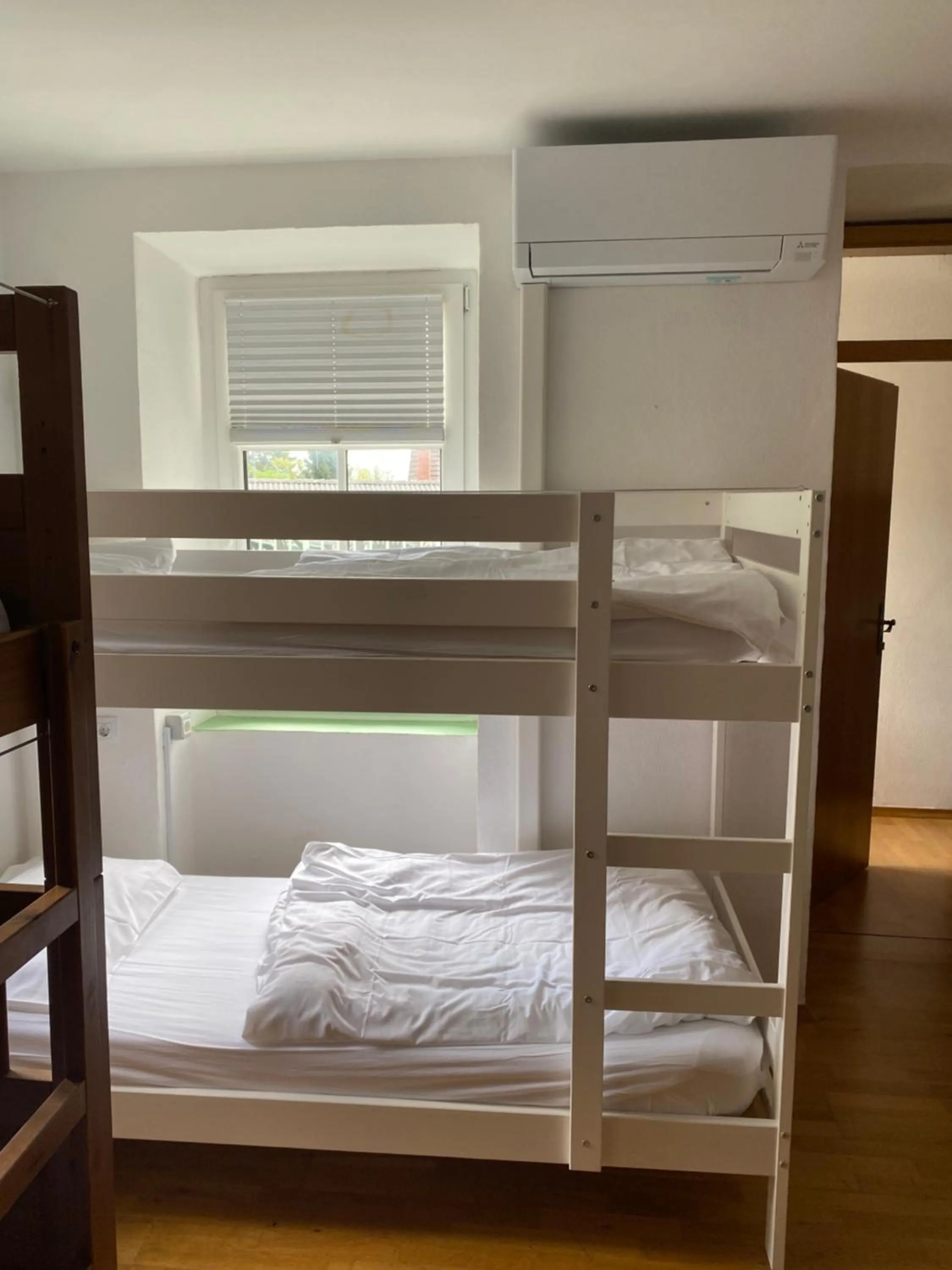 air conditioner, Bed in Travellers' Haven Hostel