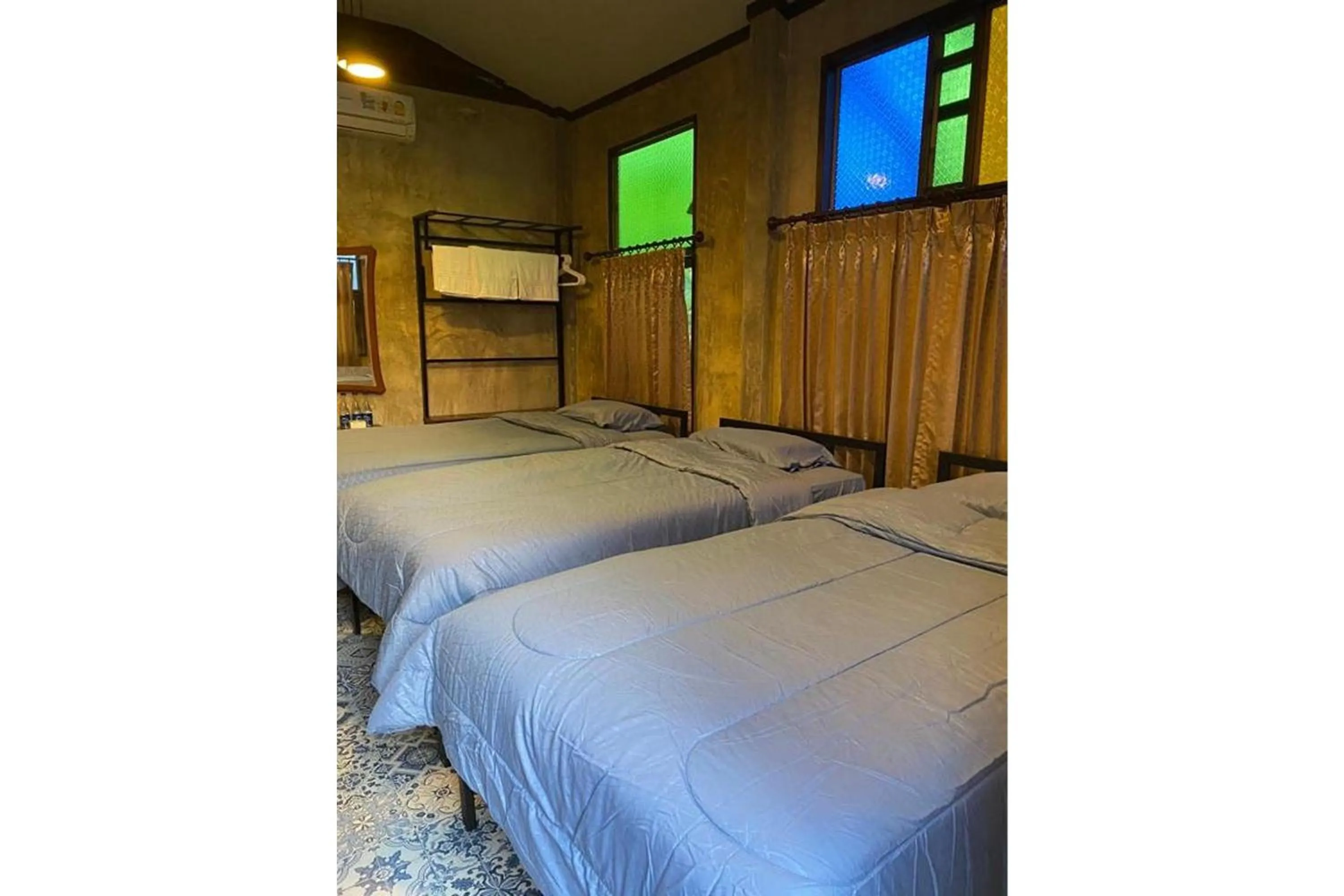 Bed in Nokkamin Home Chiang Dao