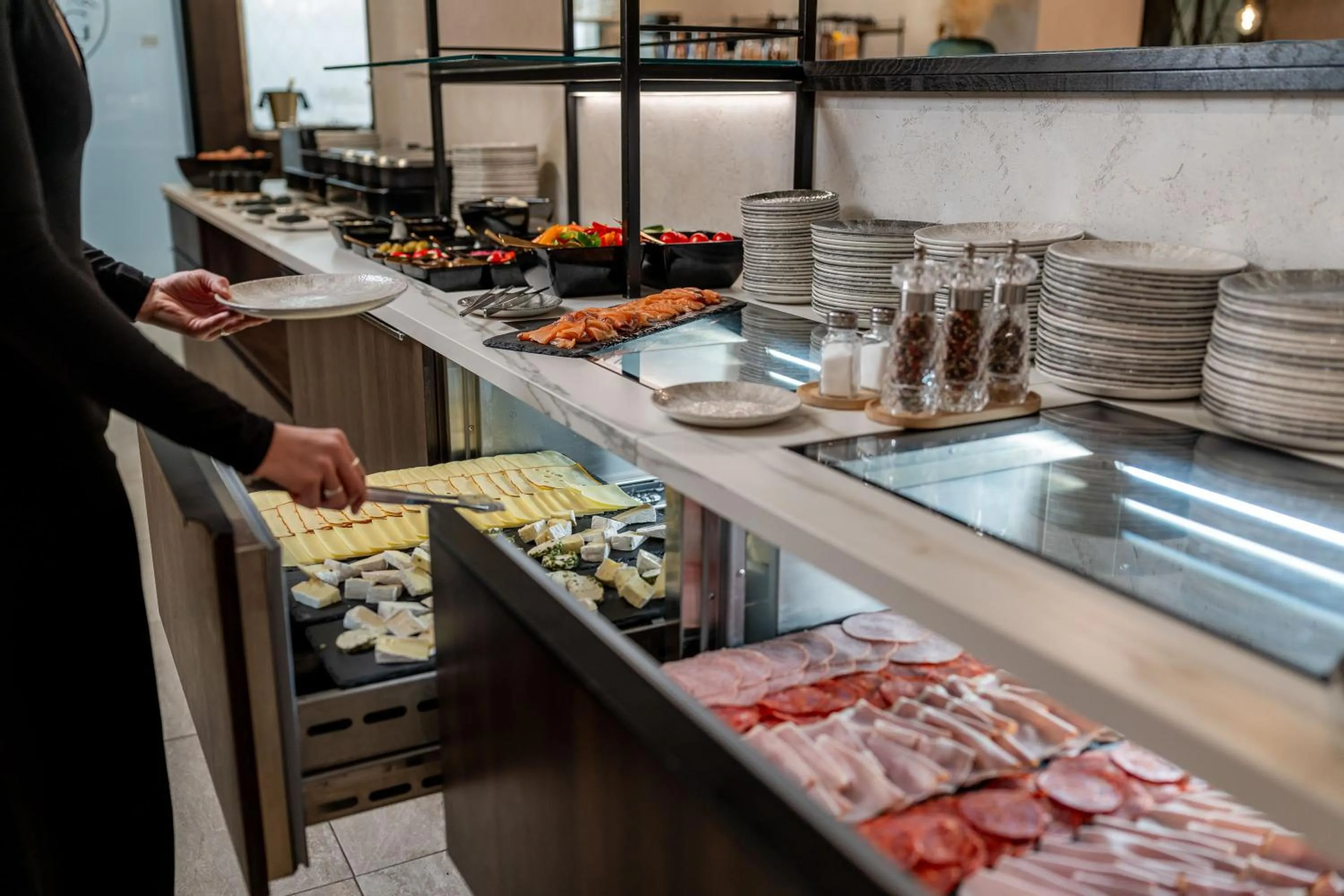 Buffet breakfast in GLEMM by AvenidA Superior Hotel & Residences