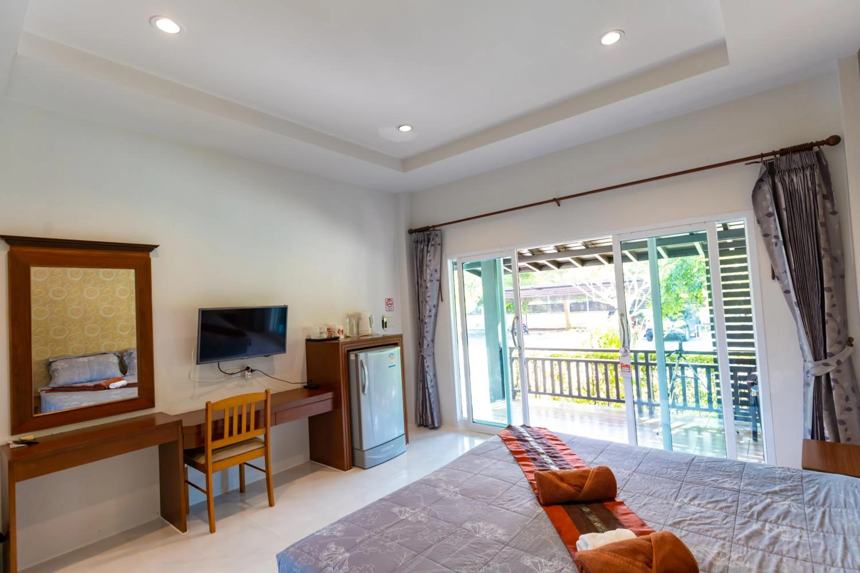 Communal lounge/ TV room, Bed in Nature Line Resort