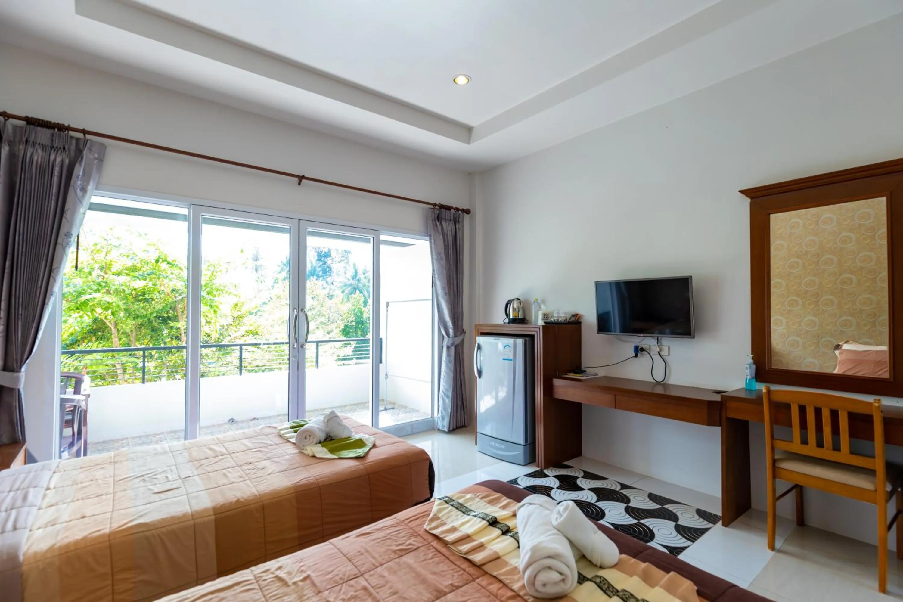 Communal lounge/ TV room, Bed in Nature Line Resort