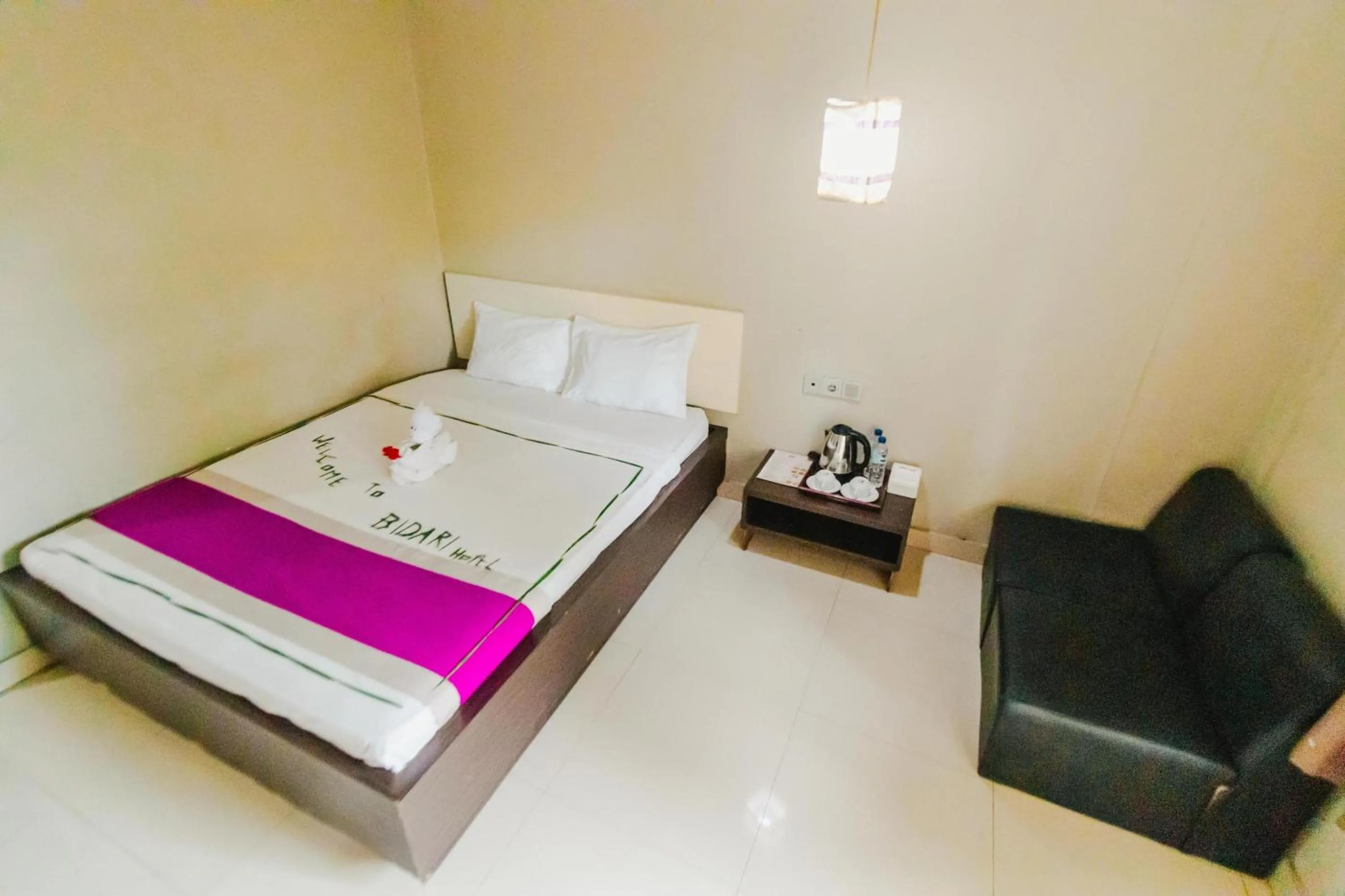 Living room, Bed in Bidari Hotel Lombok