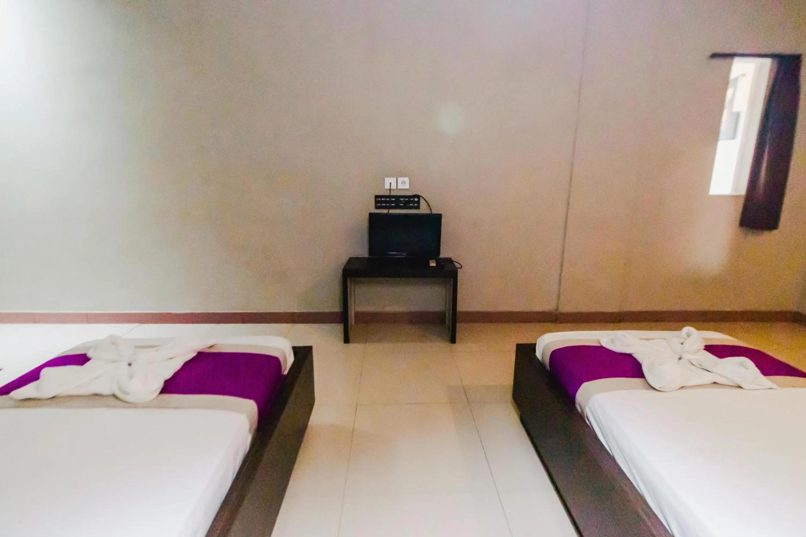 Bed in Bidari Hotel Lombok