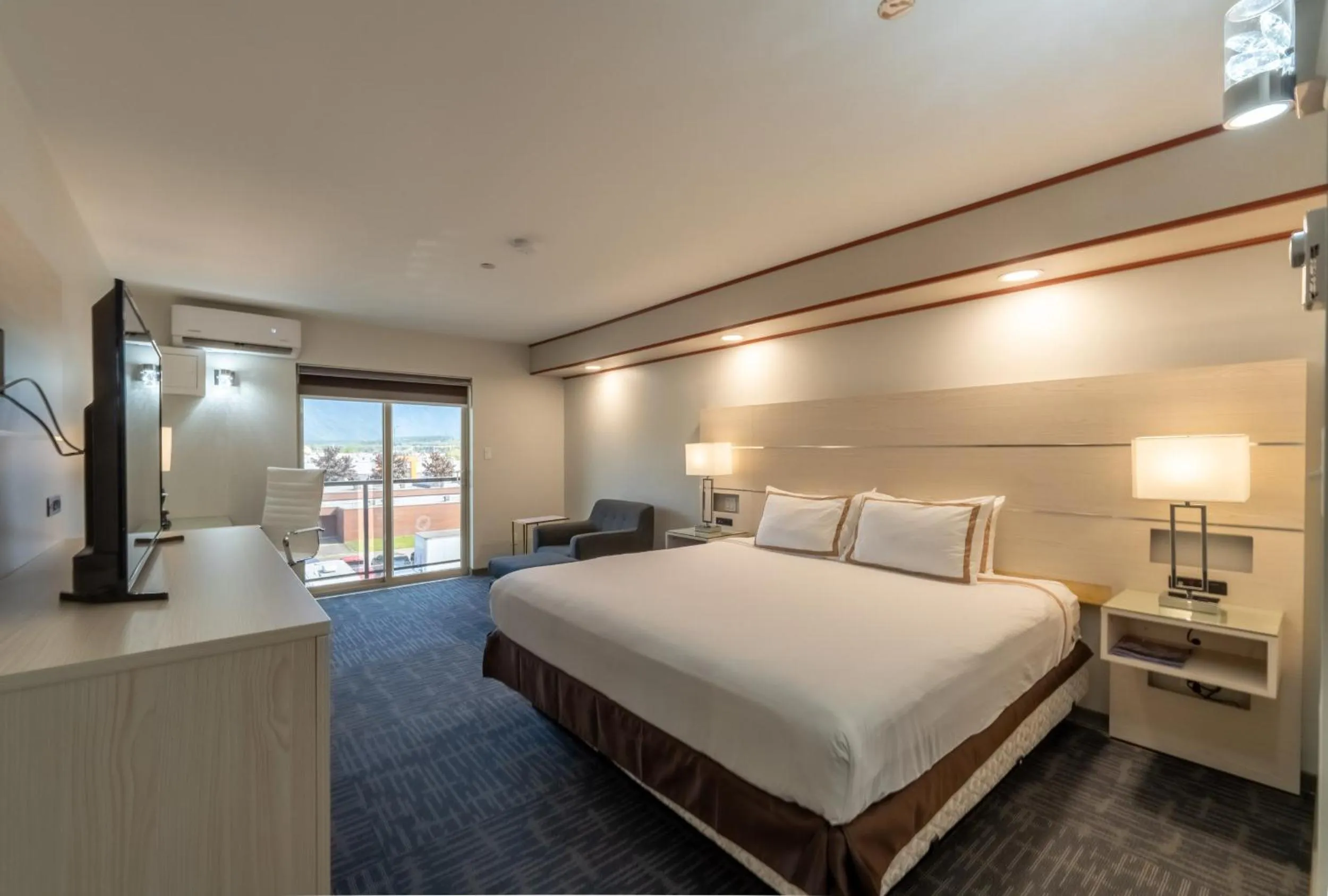 Bed in Quality Inn Sunshine Suites