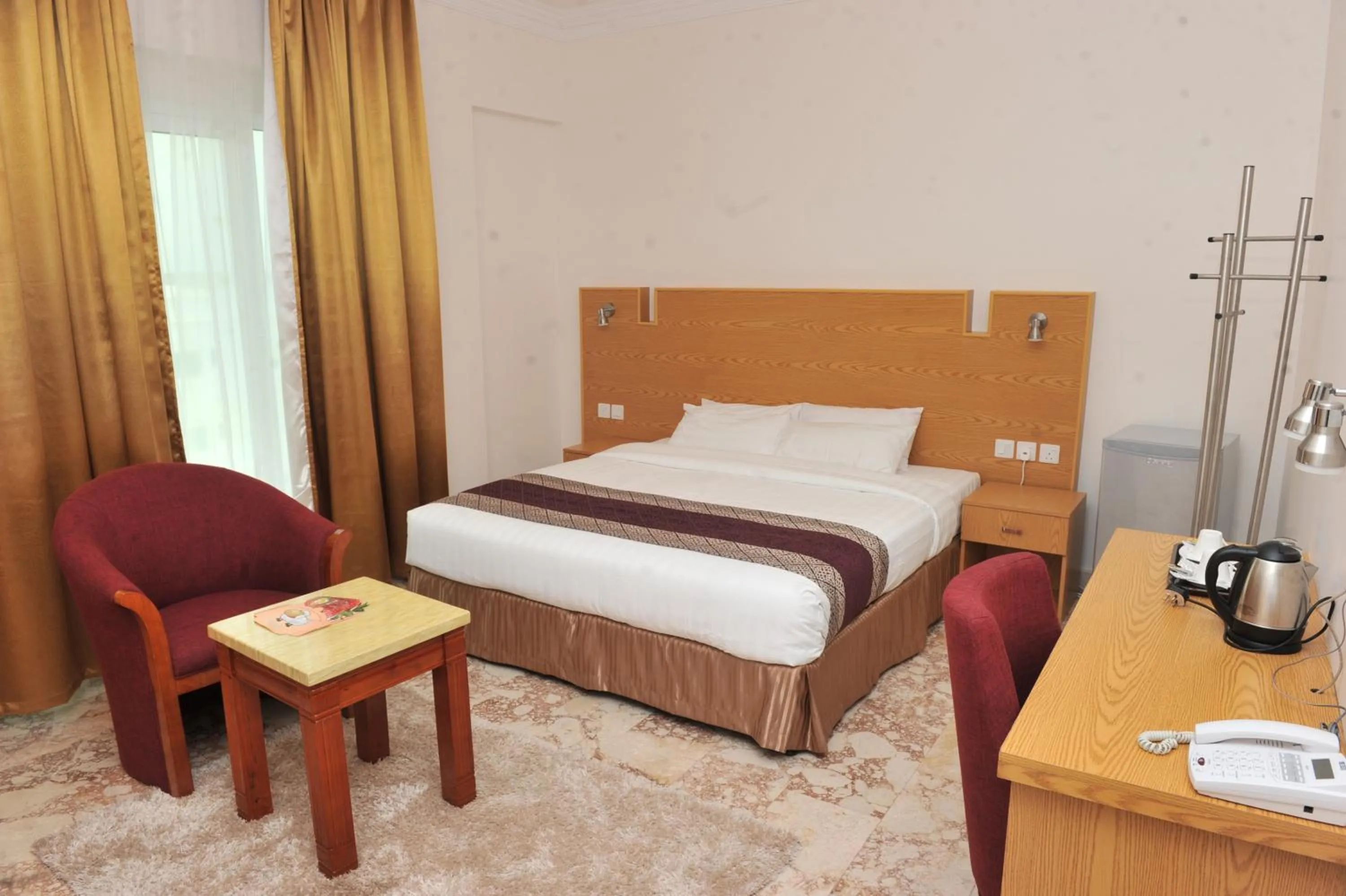 Bed in Al Reef Hotel