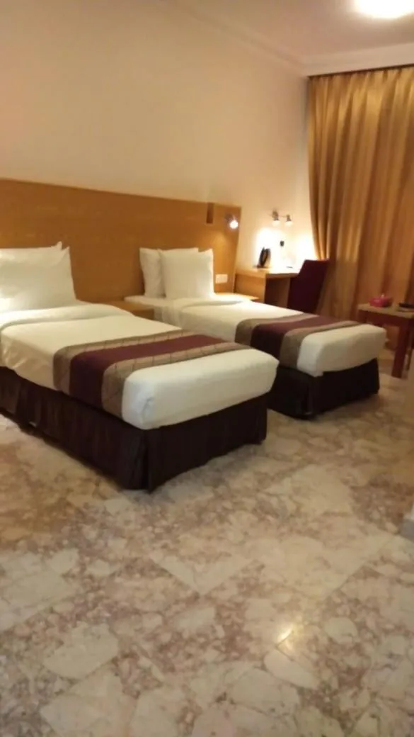 Bed in Al Reef Hotel
