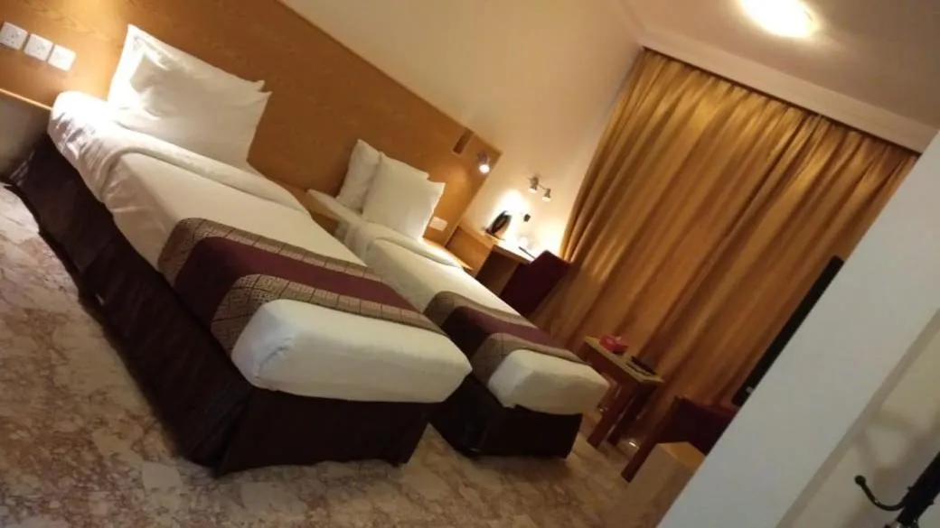Bed in Al Reef Hotel