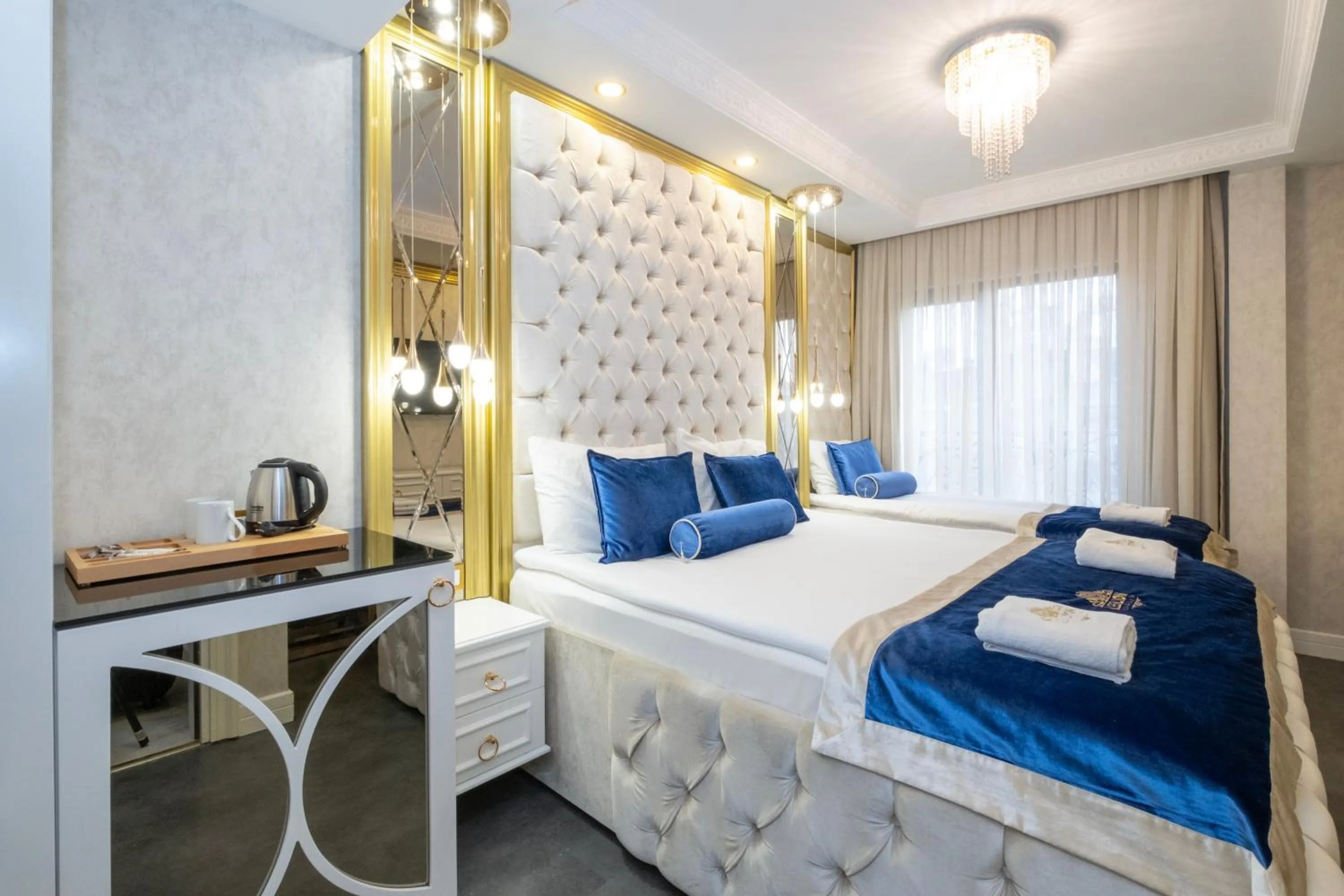 Bed in Leslion Luxury Hotel