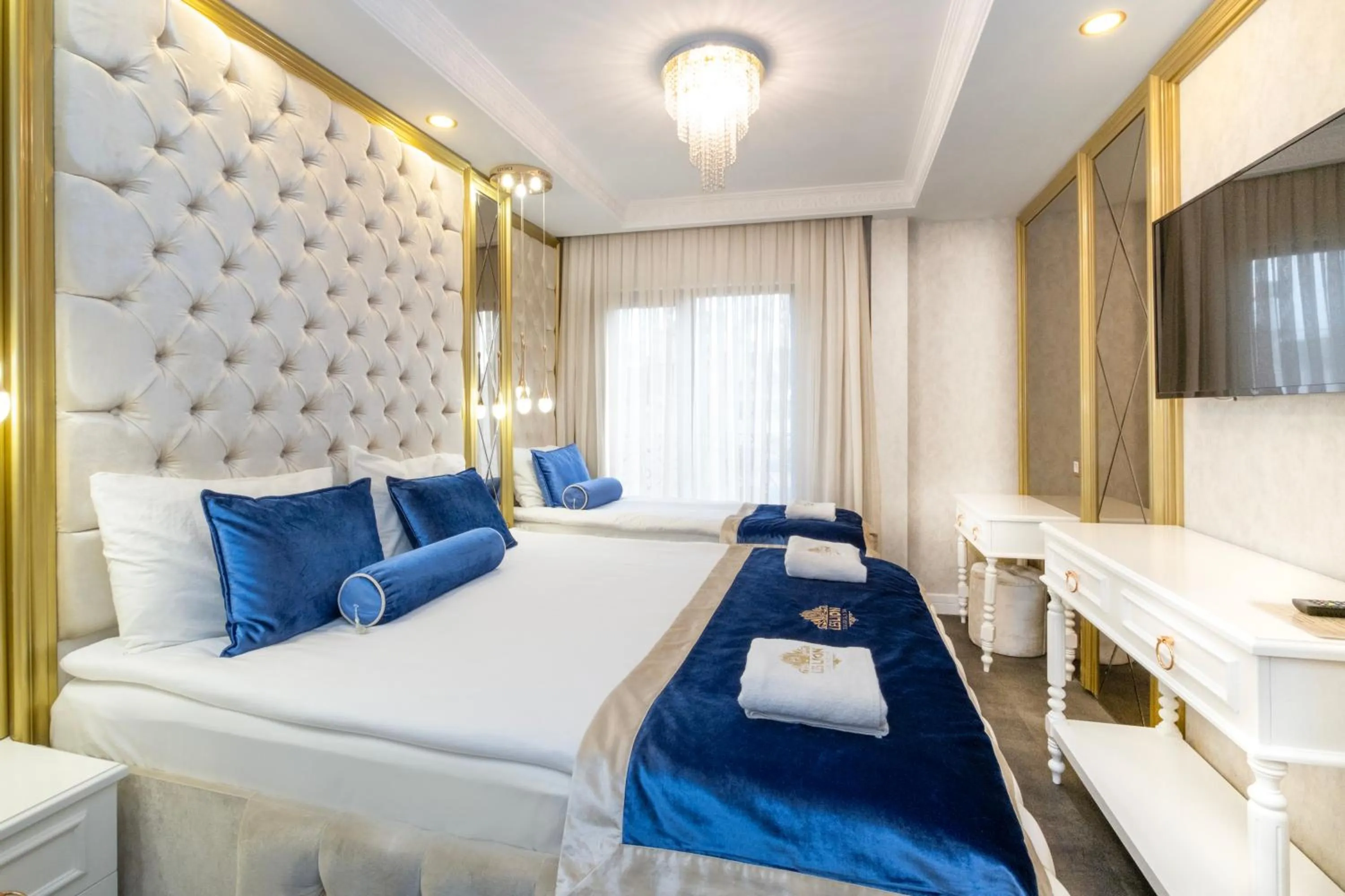 Bed in Leslion Luxury Hotel