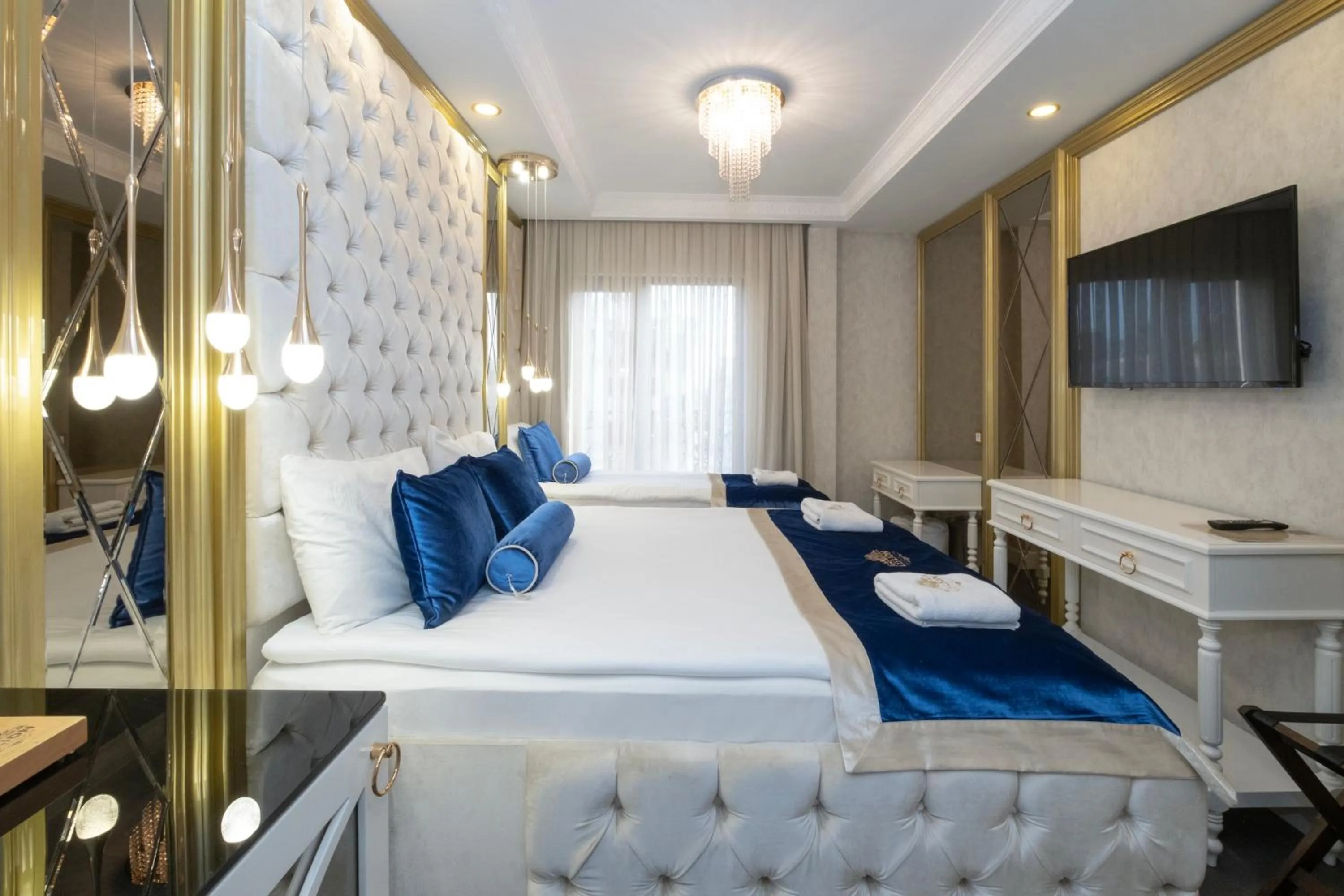 Bed in Leslion Luxury Hotel