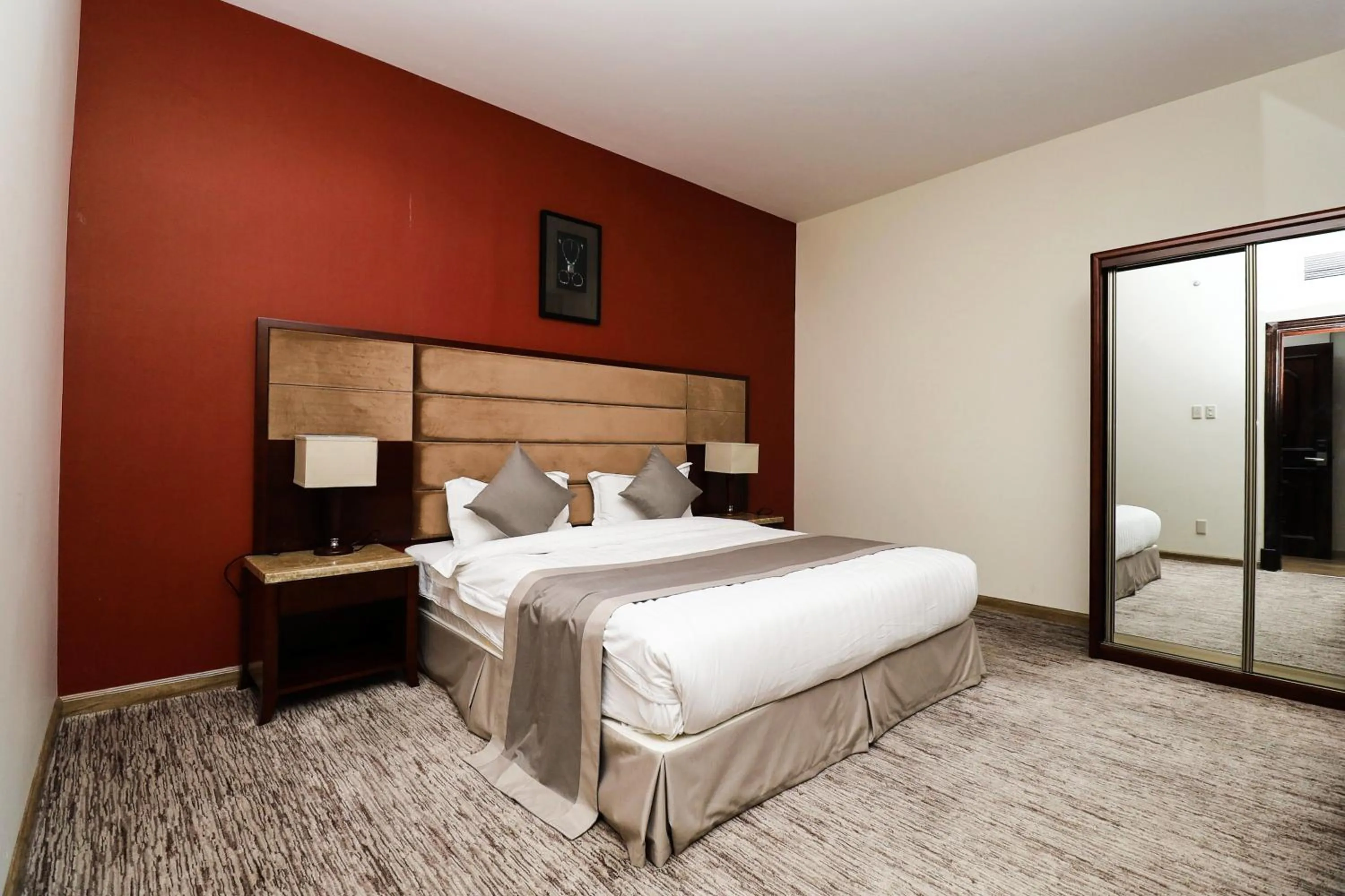 Bed in شقق مسكن المدينة للشقق المخدومة