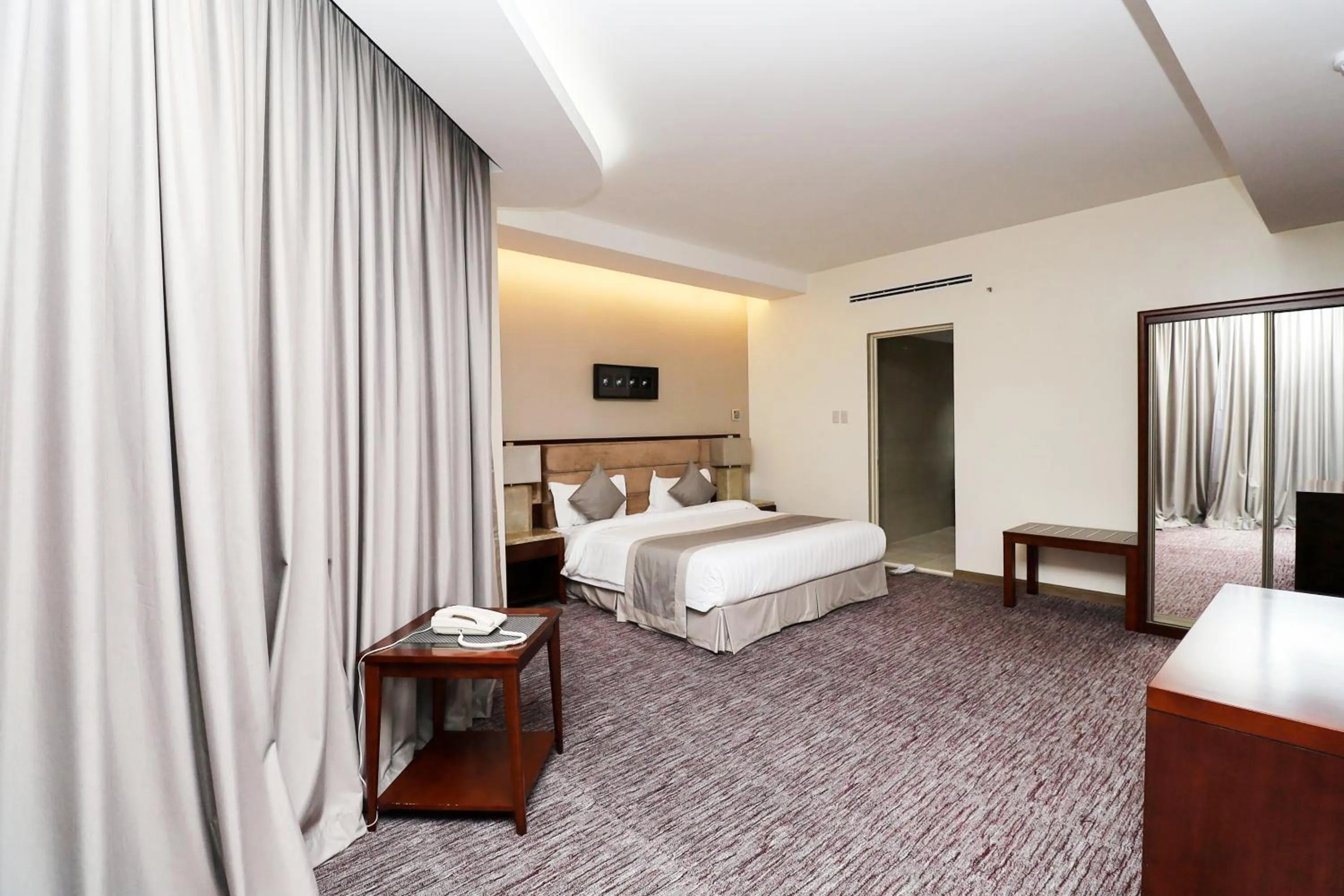 Bed in شقق مسكن المدينة للشقق المخدومة