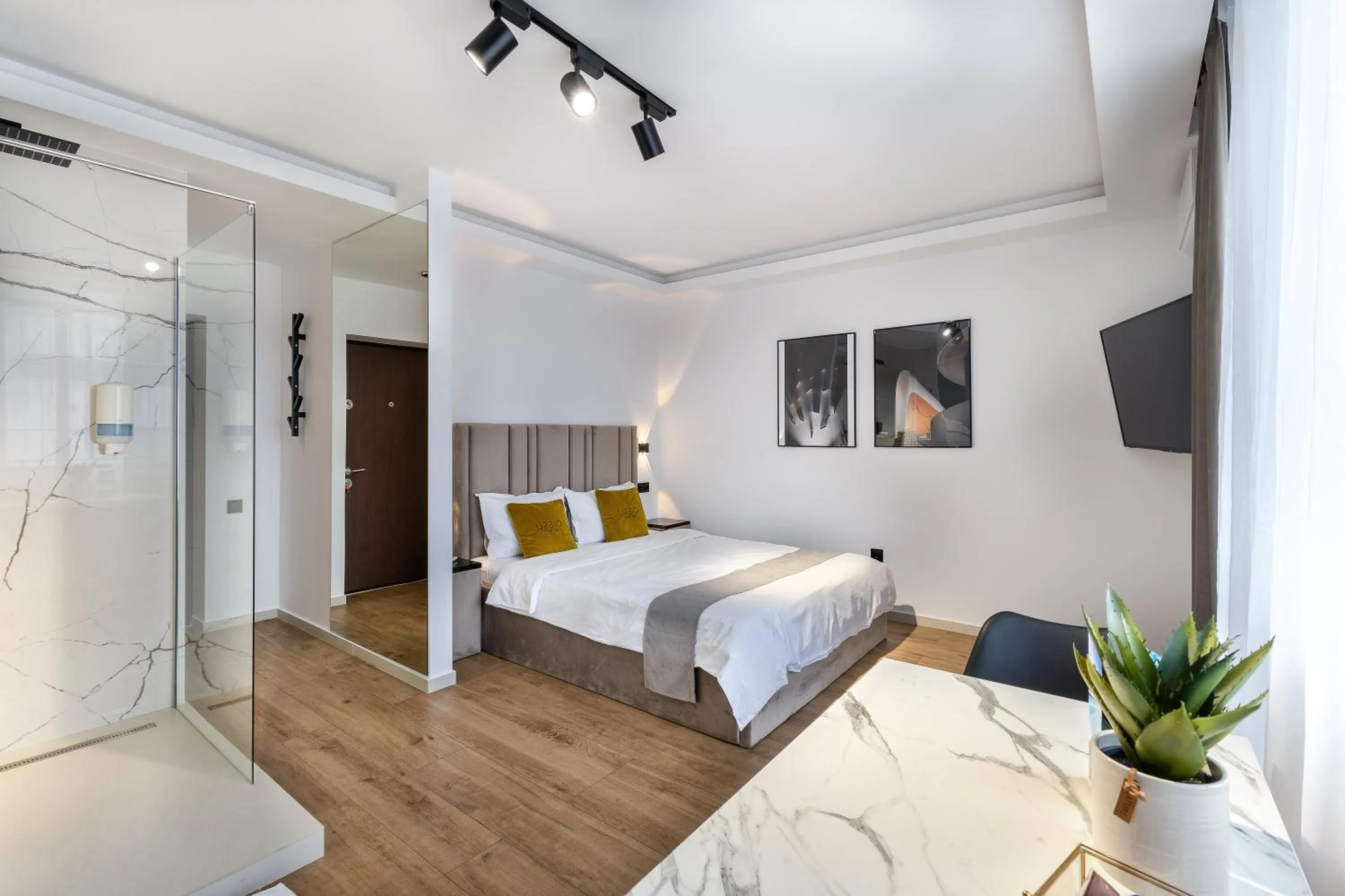 Shower, Bed in Urbio Private Suites