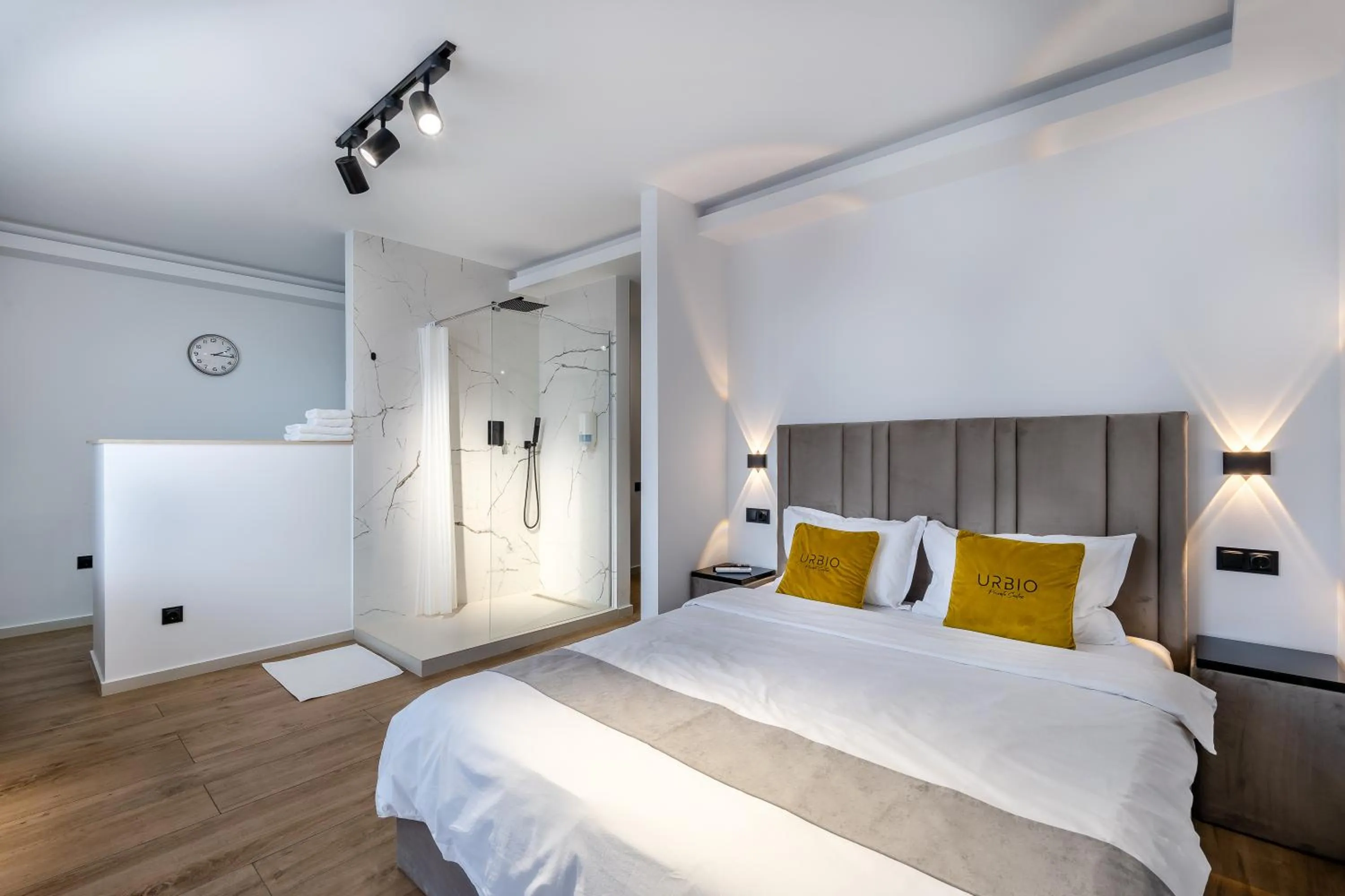 Shower, Bed in Urbio Private Suites