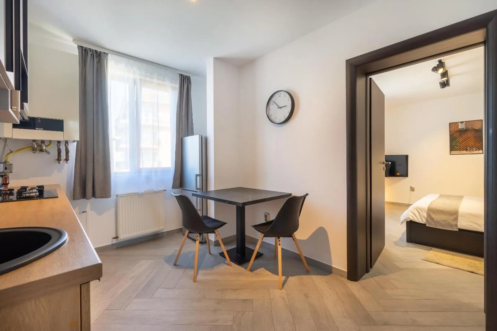 Kitchen or kitchenette, Bed in Urbio Private Suites