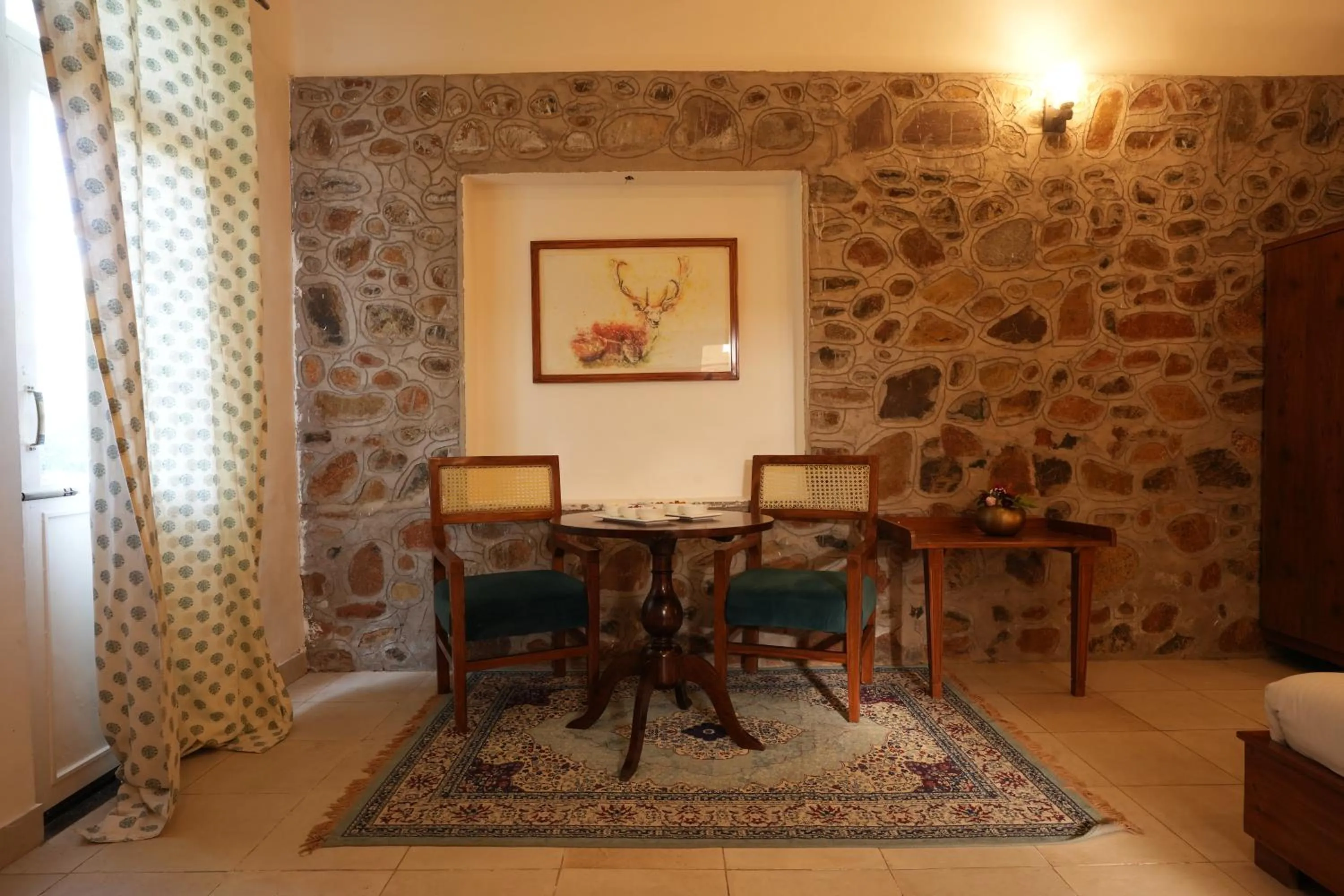 Living room in Astroport Sariska Treetop by Eight Continents