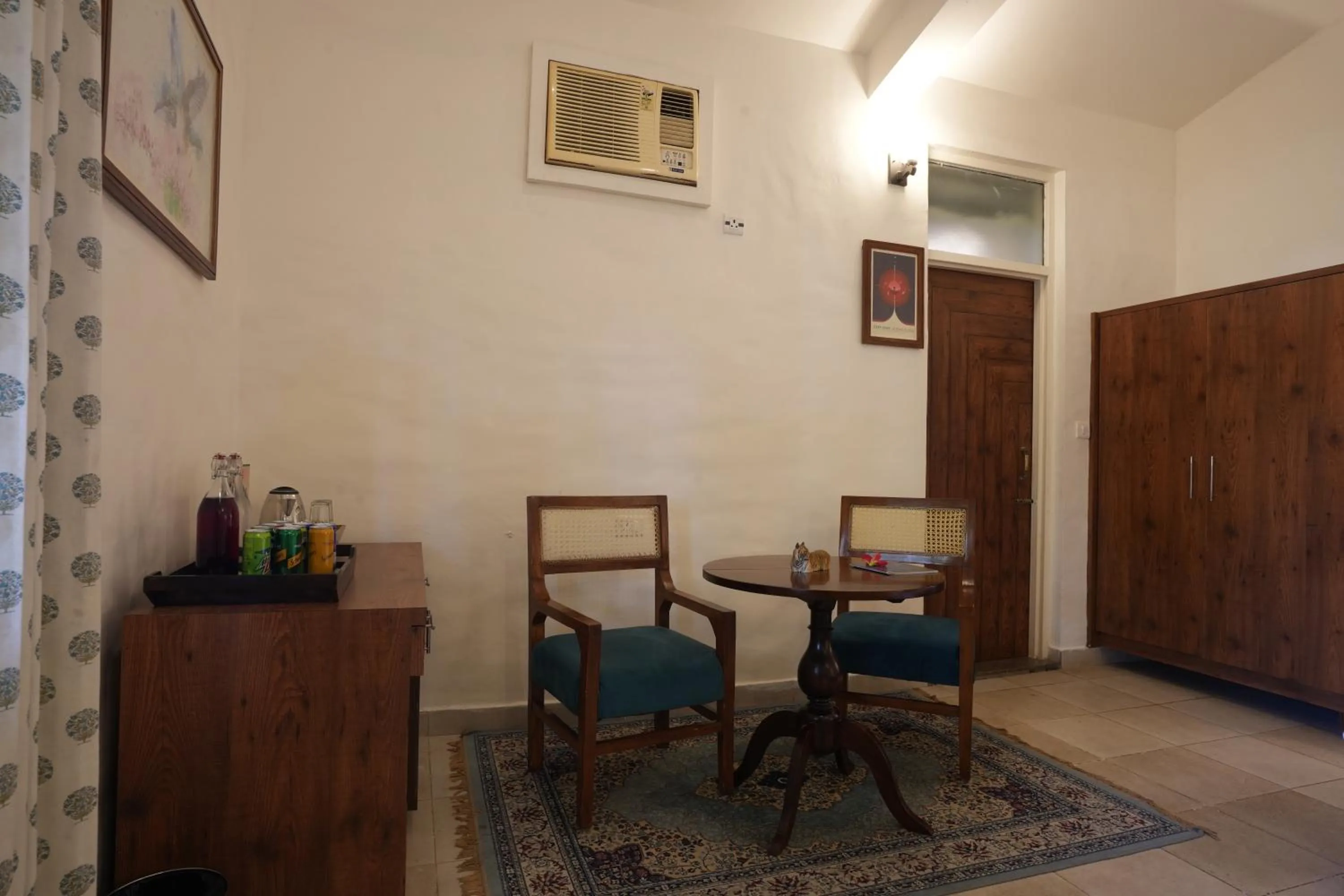 Living room in Astroport Sariska Treetop by Eight Continents