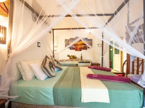Bed in Frangipani Beach Villa