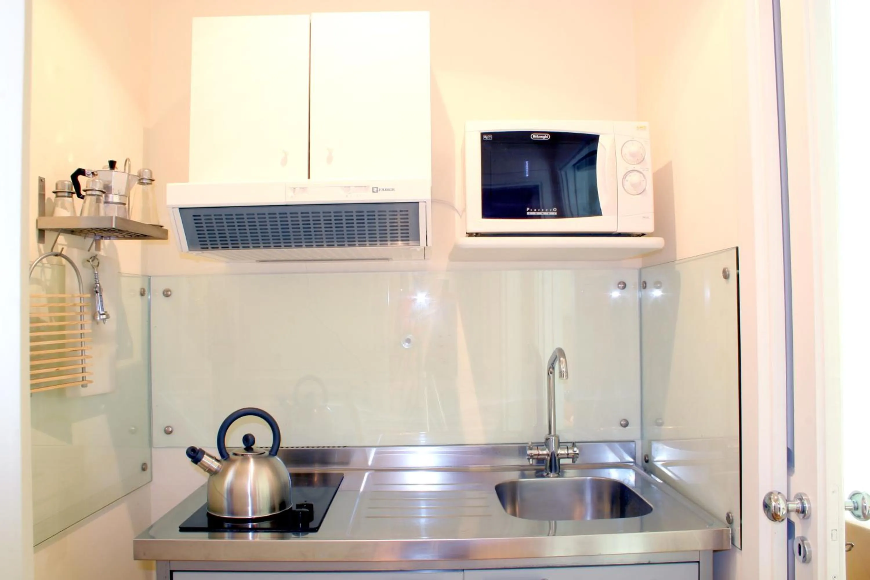 Kitchen or kitchenette in Corso Italia Suites