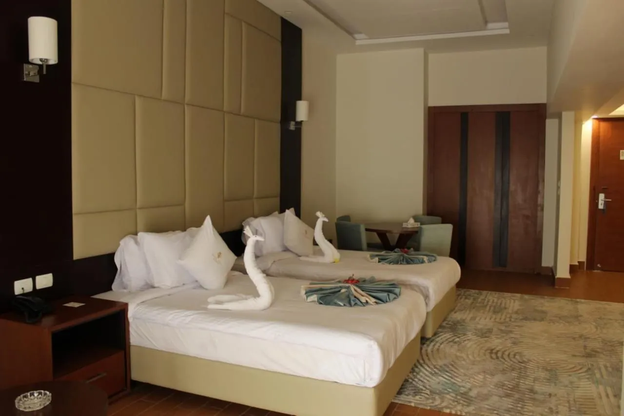 Bed in Royal Jewel Al Raml Hotel