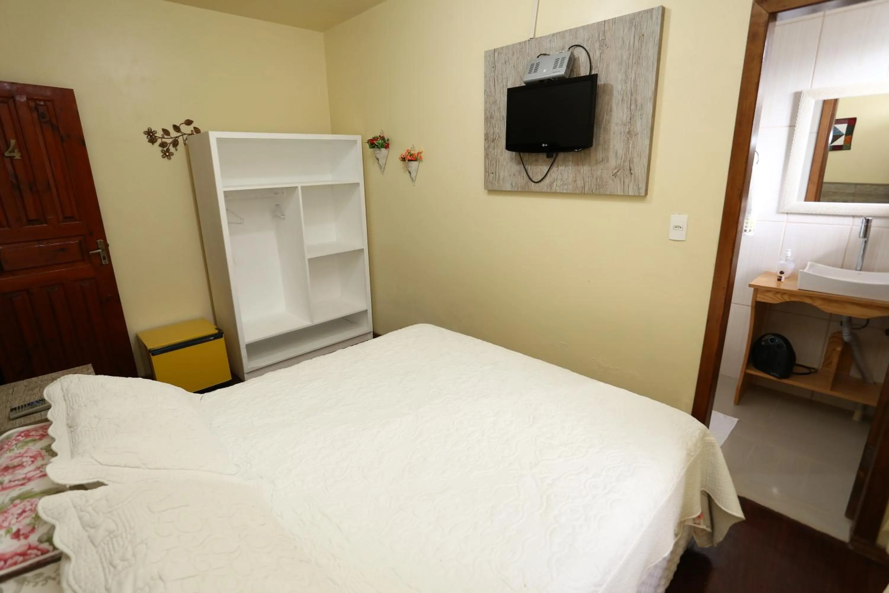 Bed in Pousada Kaluana